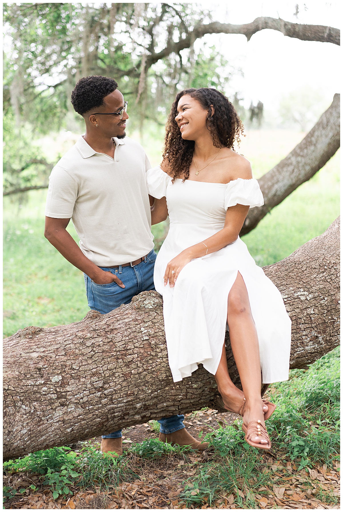 Man and woman smile at one another for Swish & Click Photography