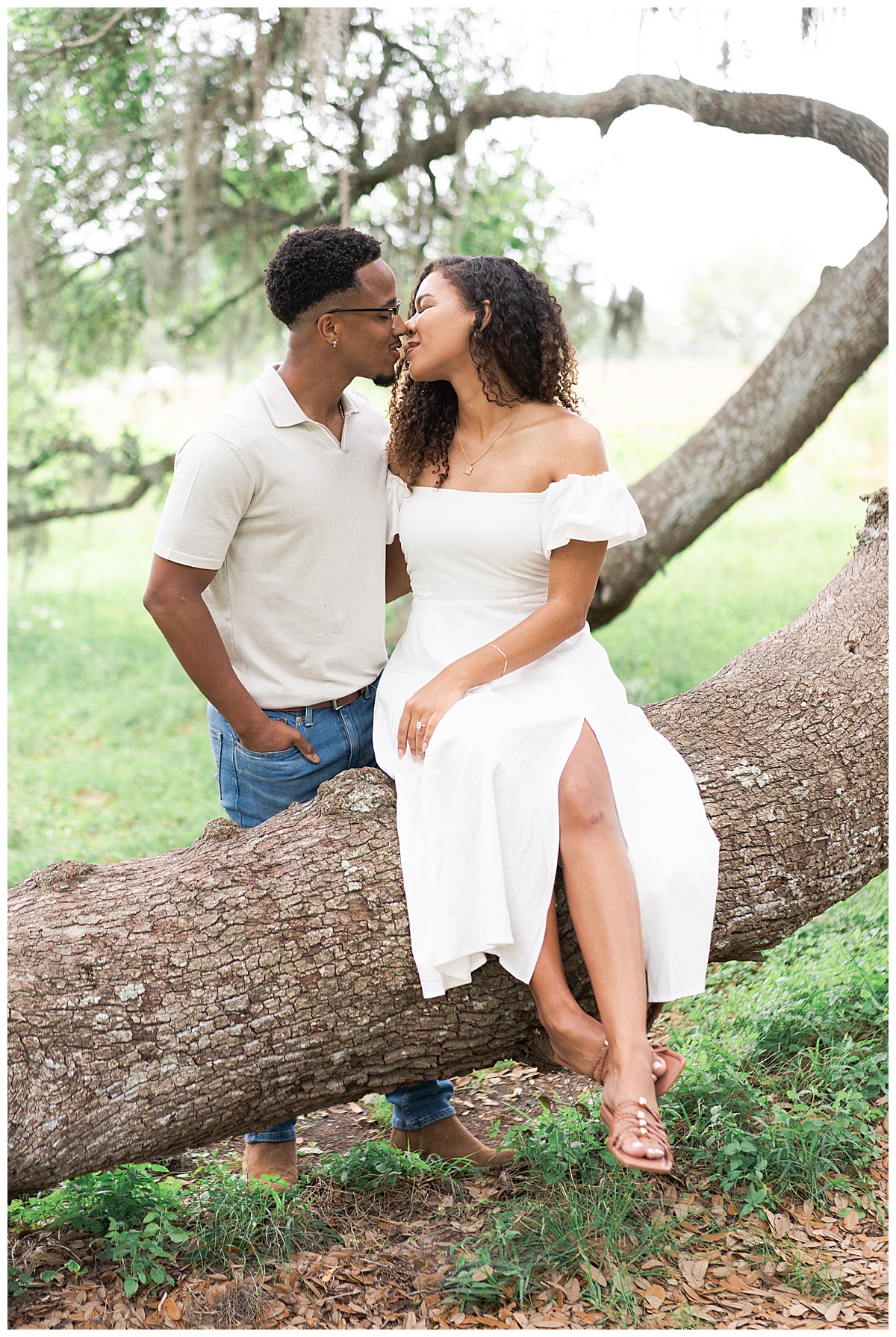 Couple share a kiss together during their Brazos Bend Engagement Photographer 