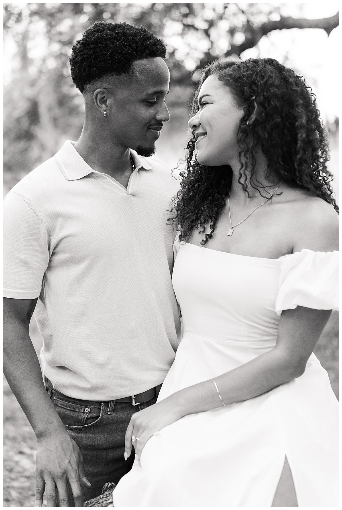 Man and woman smile at one another for Swish & Click Photography