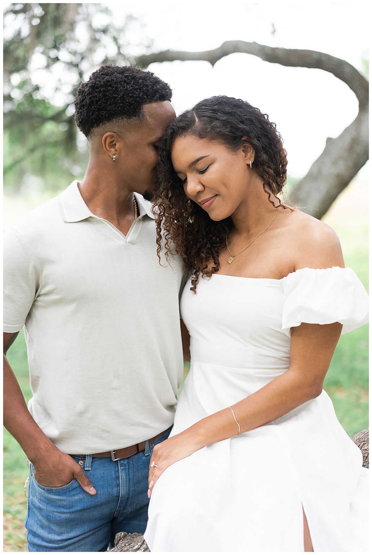 Man cuddles into woman for Brazos Bend Engagement Photographer 