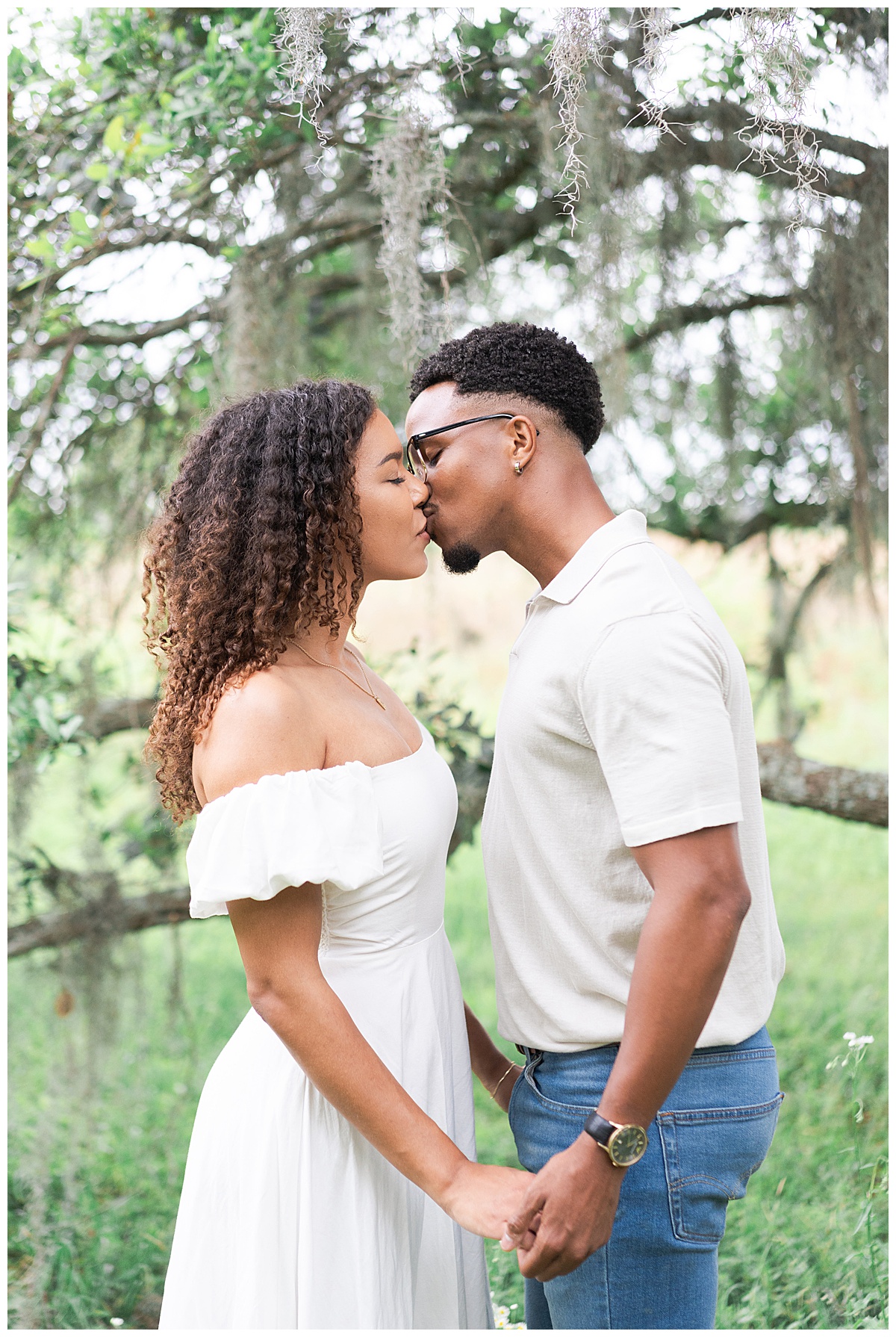 Man and woman share a kiss during their Brazos Bend Engagement Photographer 