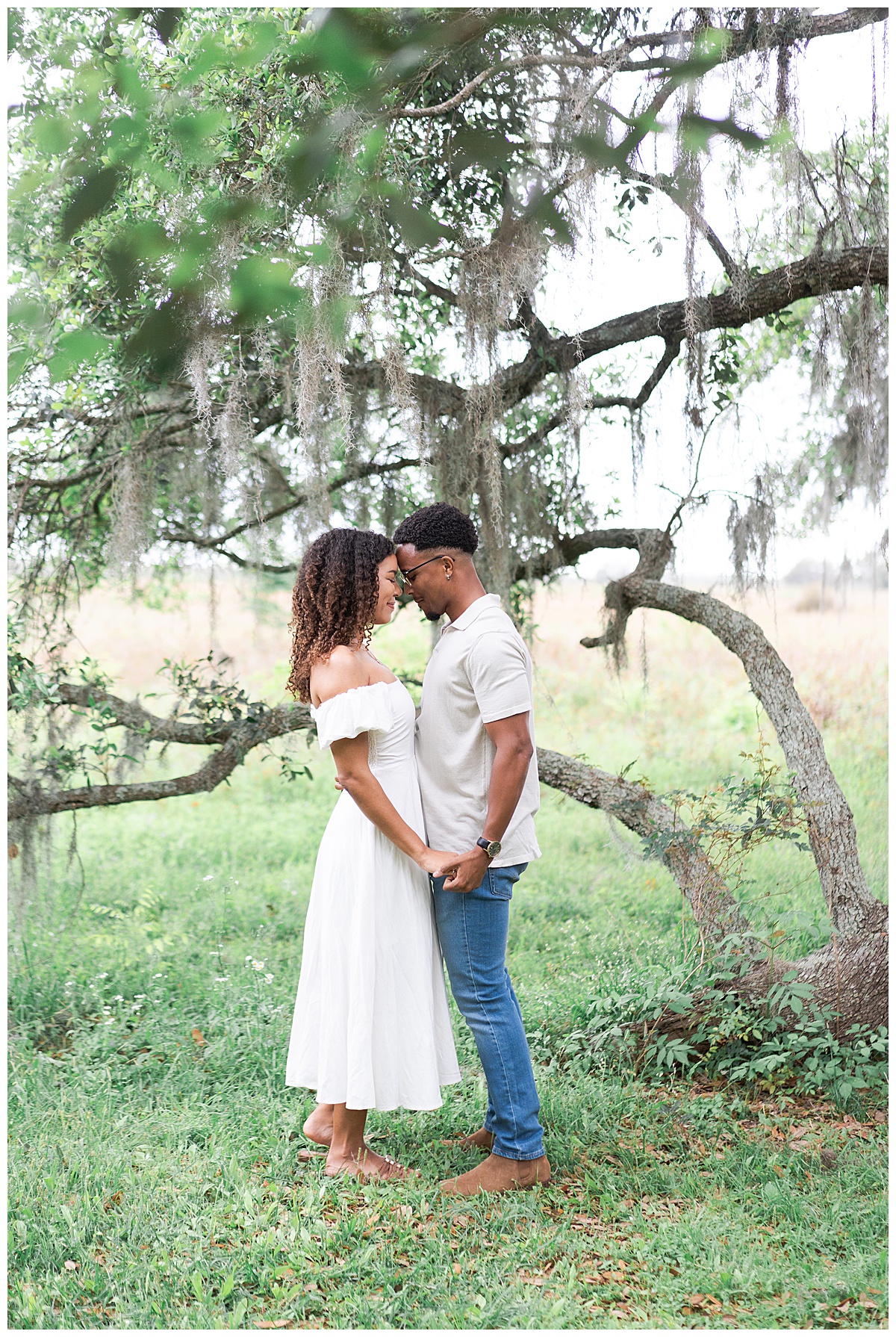 Couple share a kiss together during their Brazos Bend Engagement Photographer 