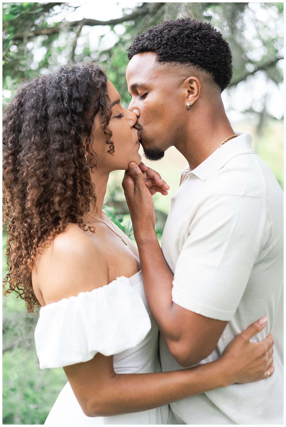 Two people share a kiss for Swish & Click Photography