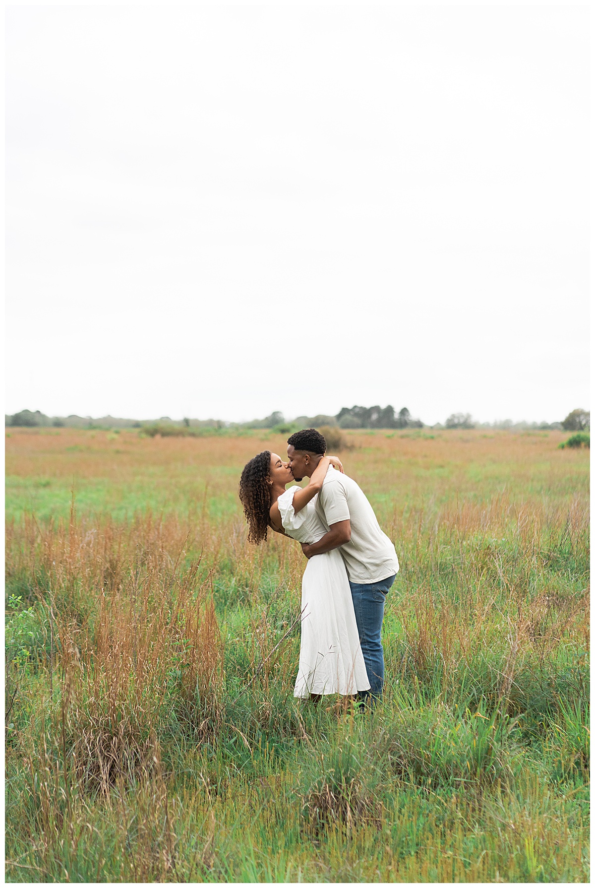 Man and woman share a hug during their Brazos Bend Engagement Photographer 