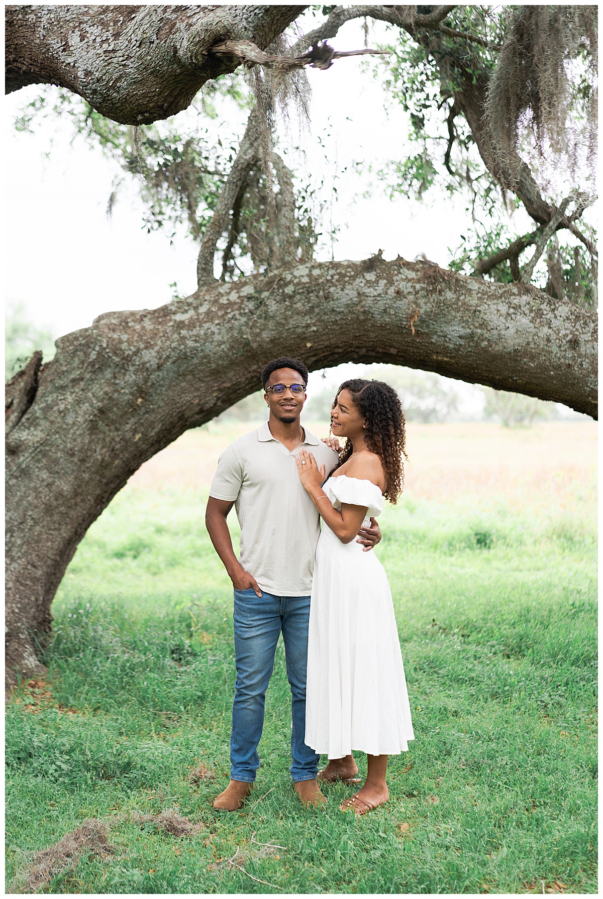 Woman holds her hand on fiancees chest during their Brazos Bend Engagement Photographer 