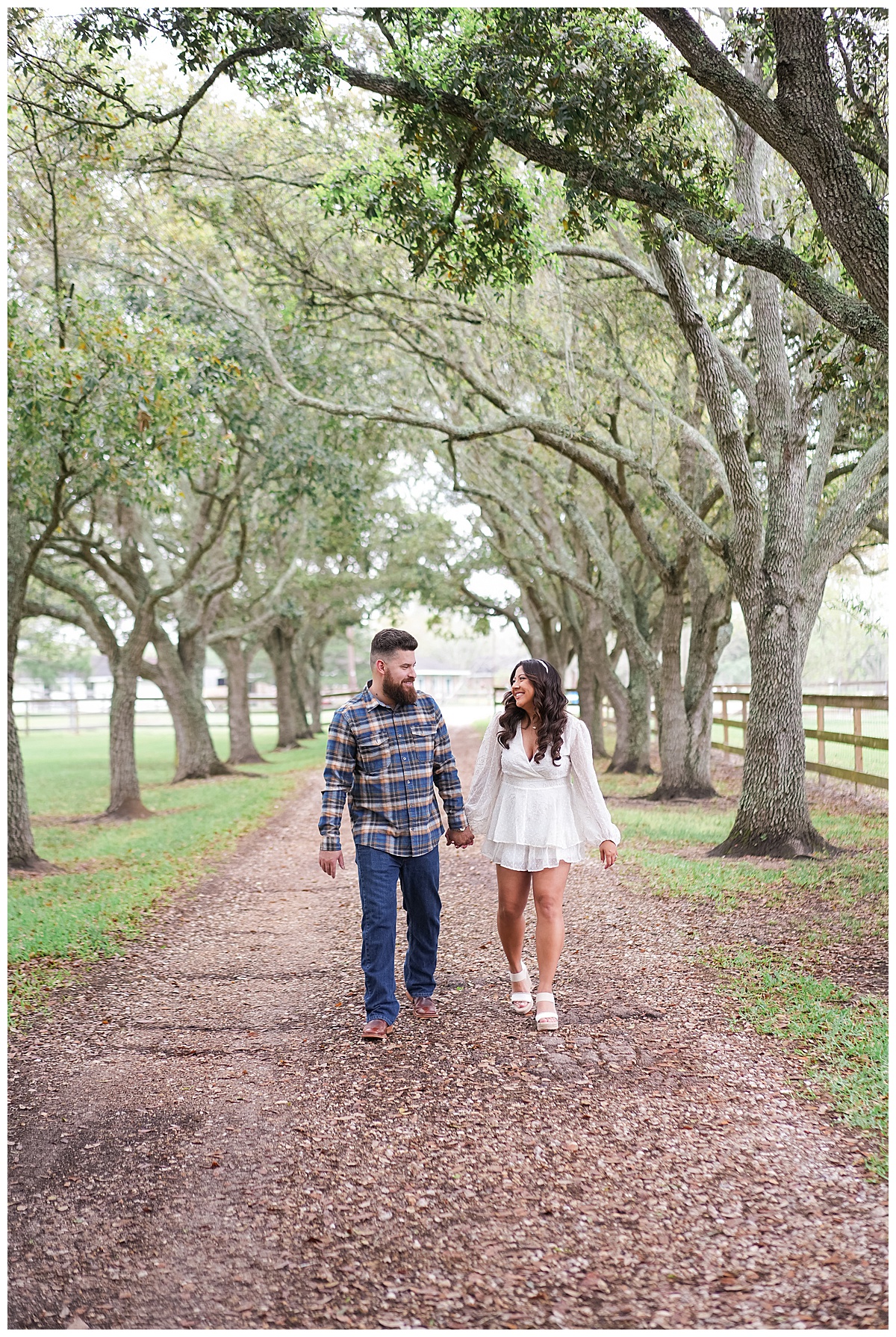 Couple smile at one another during their Houston Disney Engagement Session