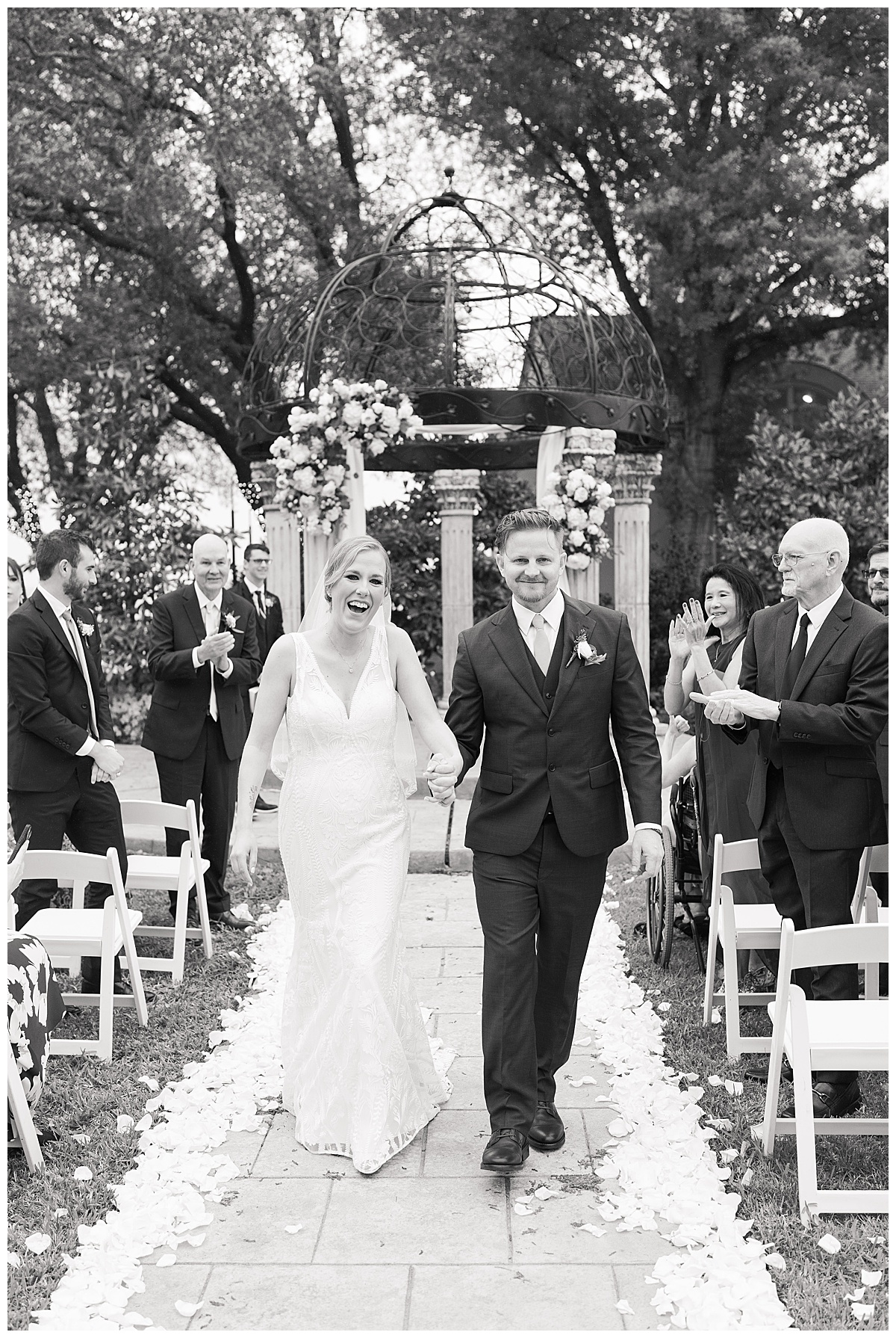 Couple walks down the aisle together for Swish & Click Photography