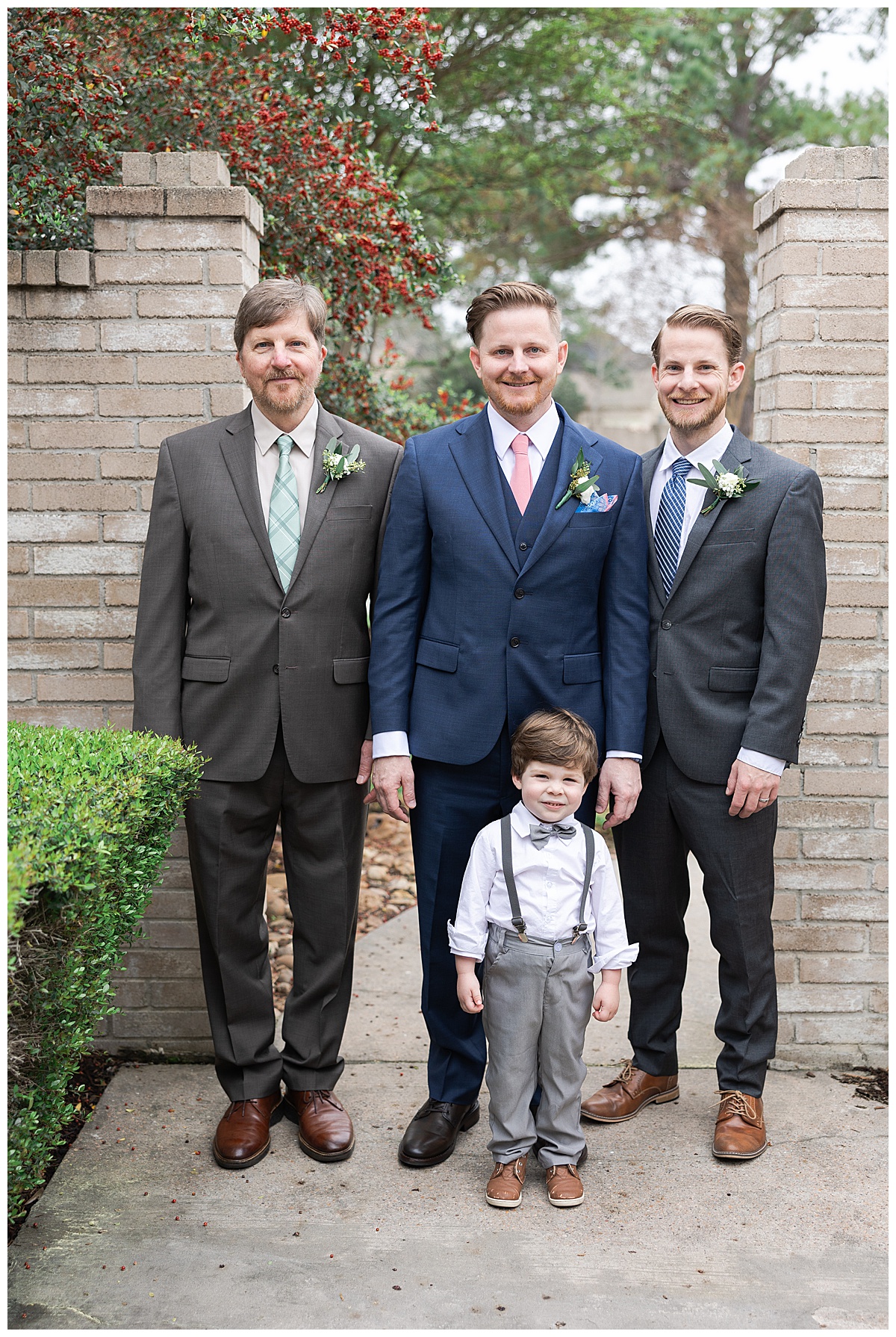Groom stands with groomsmen for Swish & Click Photography