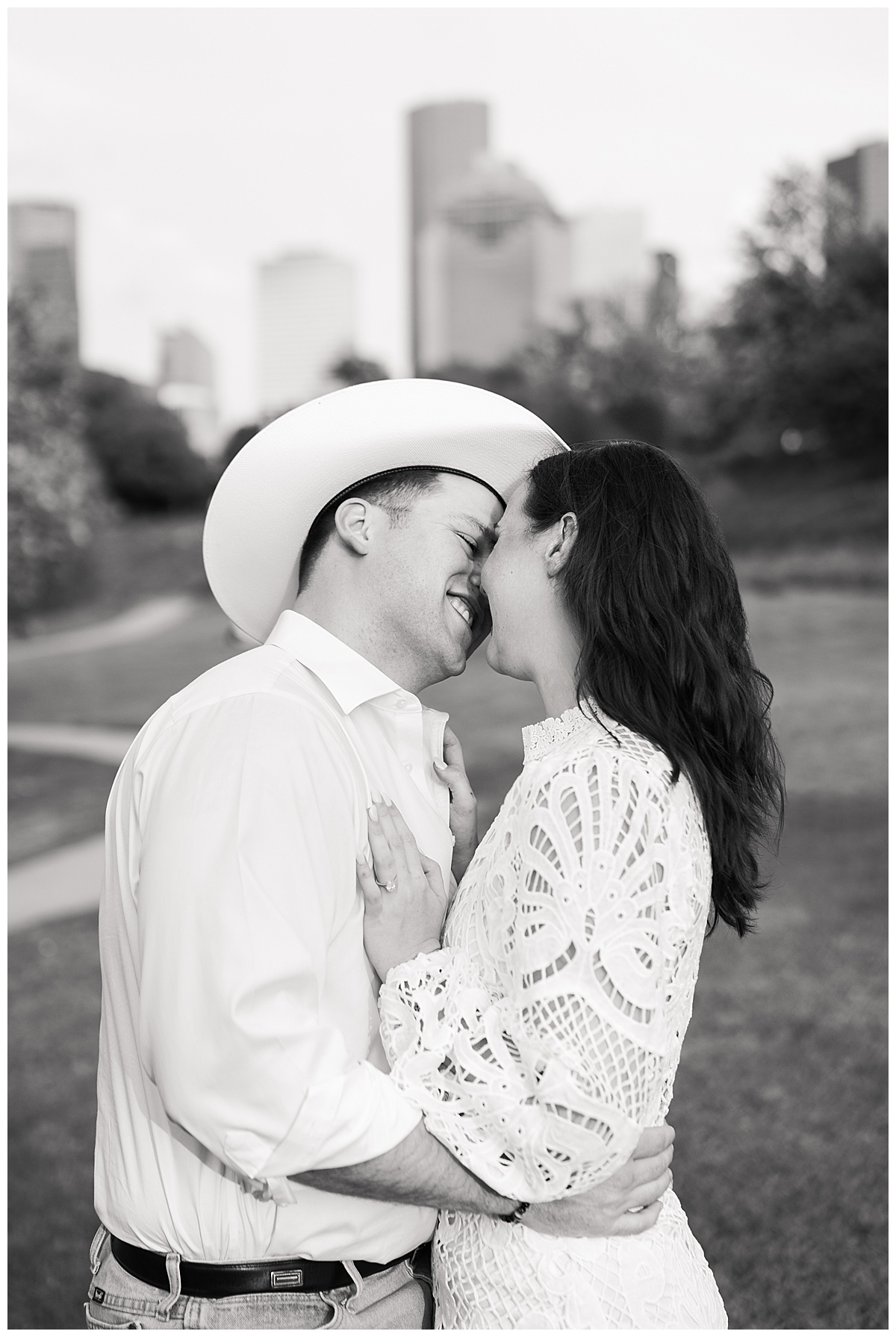 Man and woman share a kiss during their Eleanor Tinsley Park Engagement Session