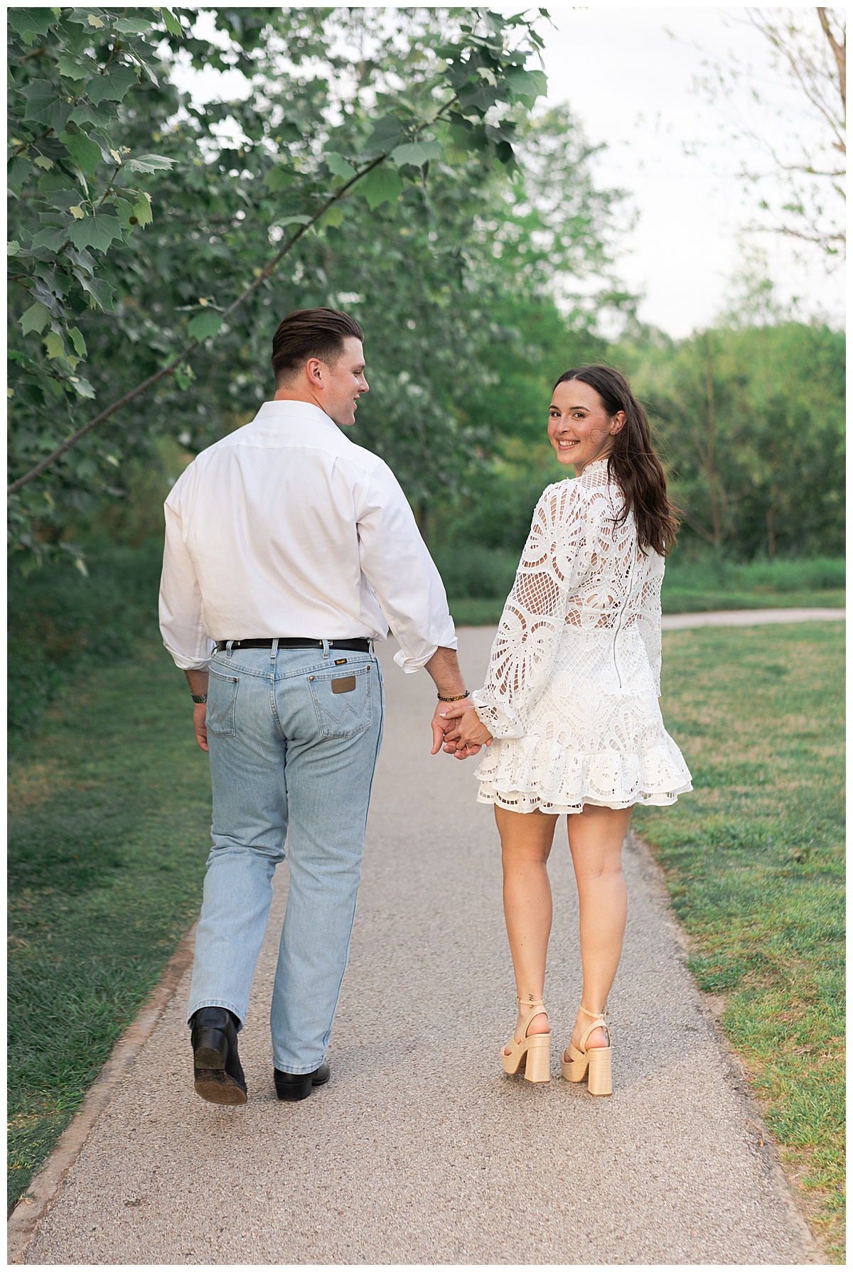 Couple walk together during their Eleanor Tinsley Park Engagement Session