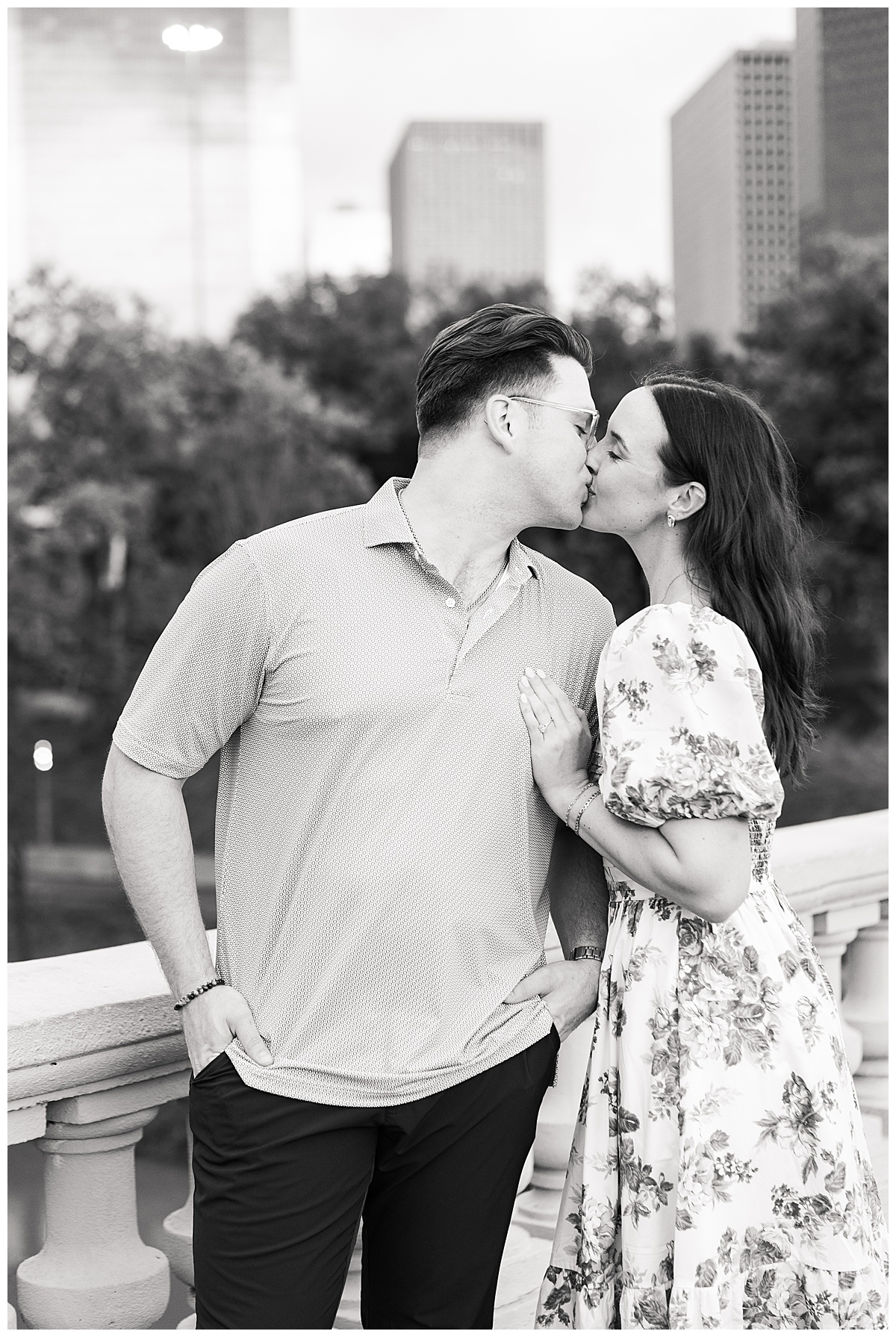 Man and woman share a kiss during their Eleanor Tinsley Park Engagement Session