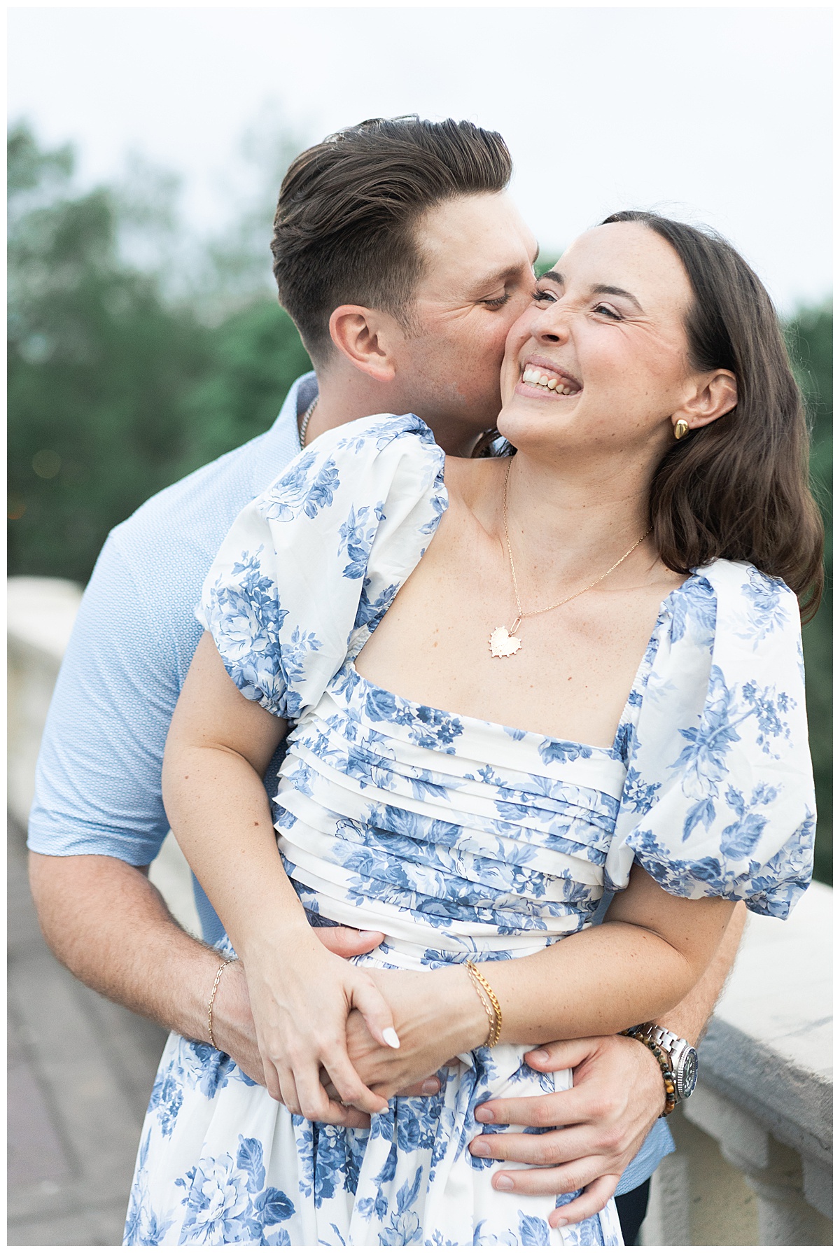 Couple cuddle in close together during their Eleanor Tinsley Park Engagement Session