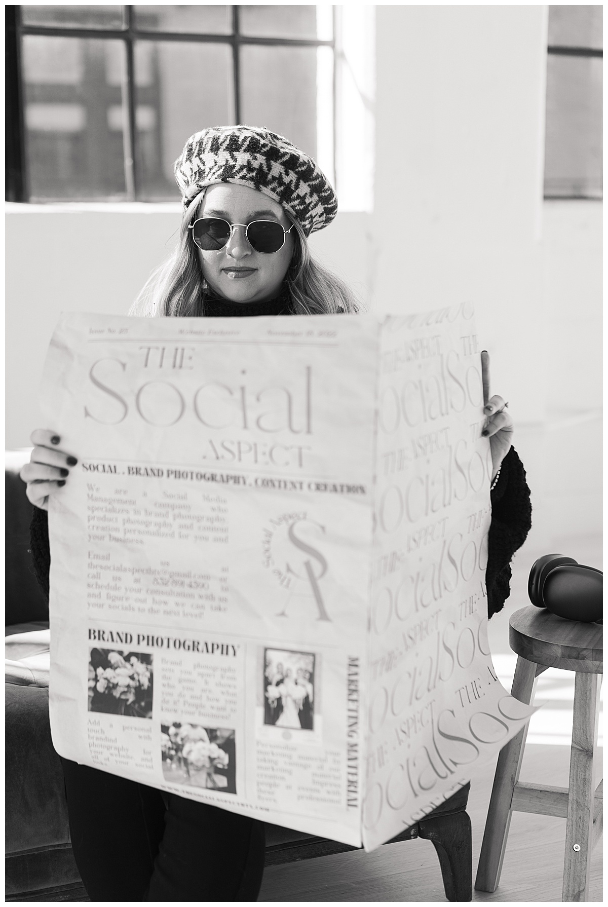 Female reads the newspaper for Houston Editorial Branding Photographer