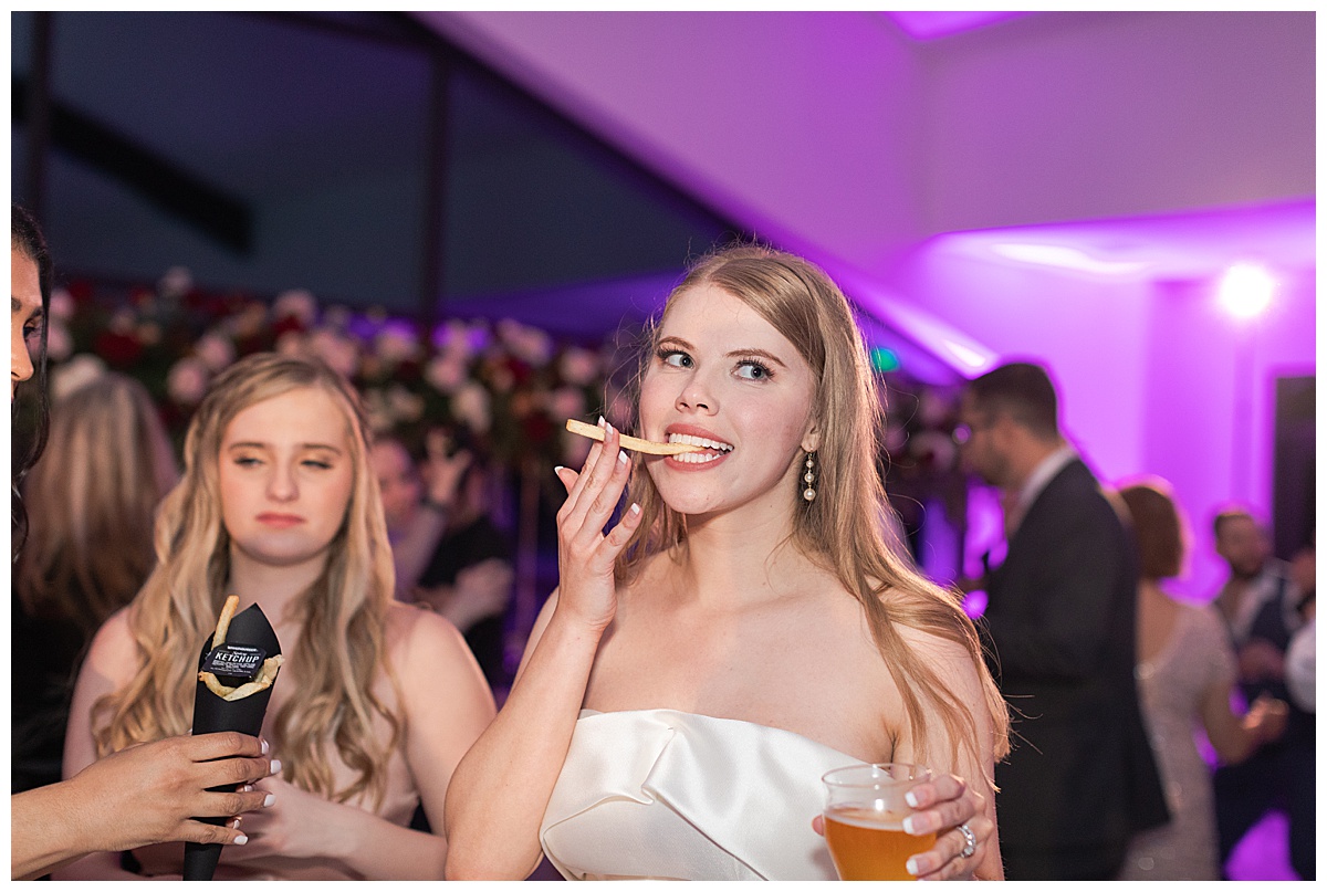 Bride enjoys her lat night snack for Swish & Click Photography