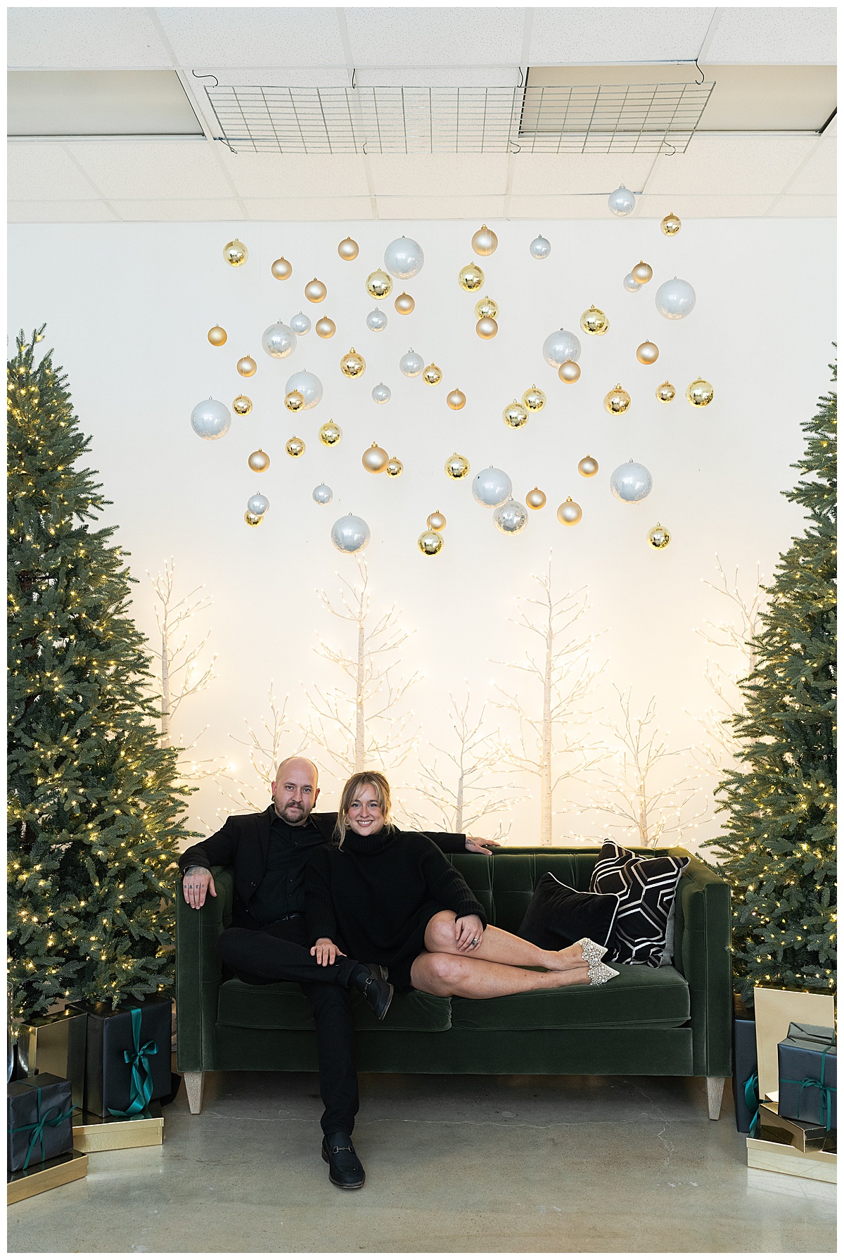 Couple sit together on the couch during Christmas Minis In Houston