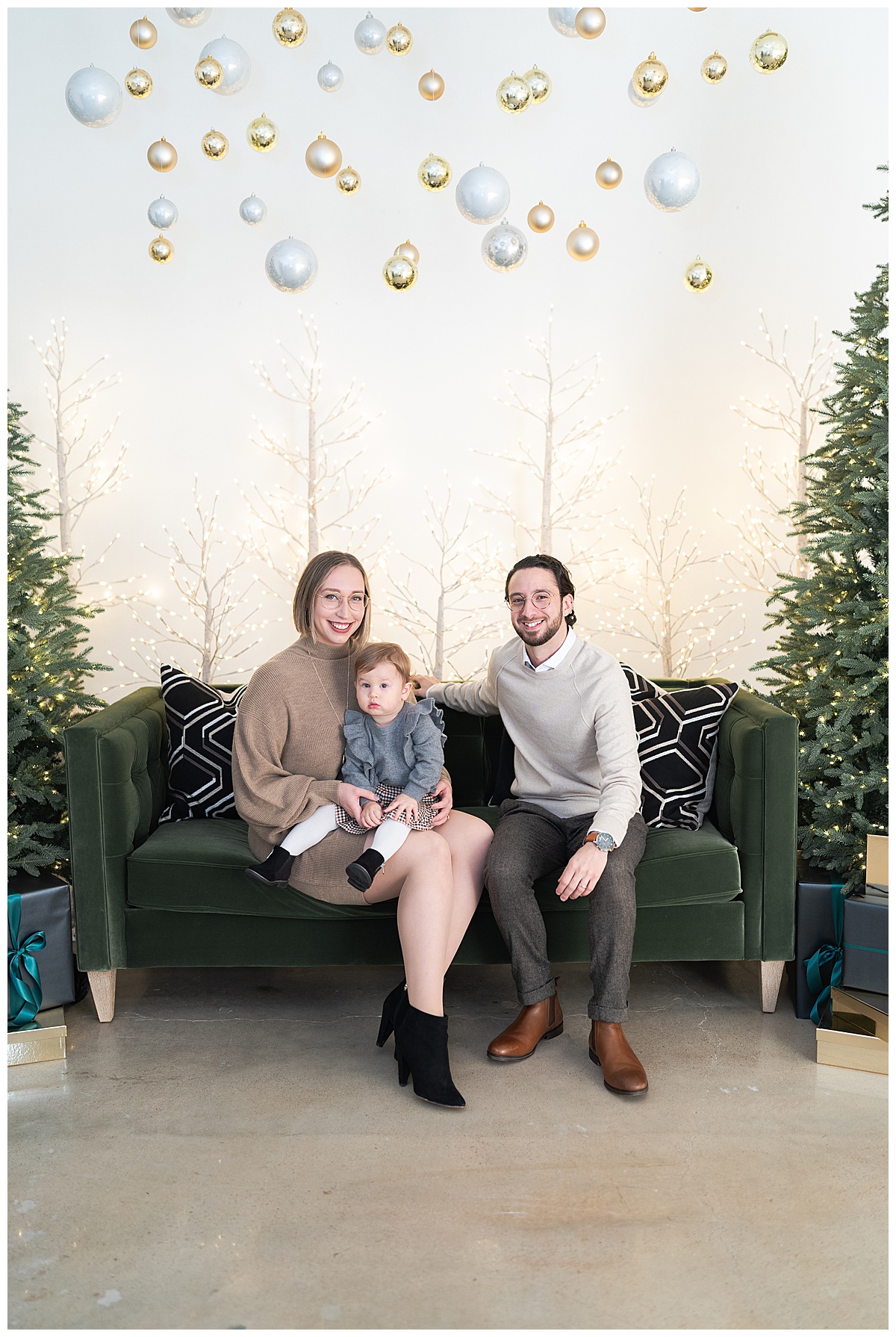 Family sit on the couch together for Swish & Click Photography