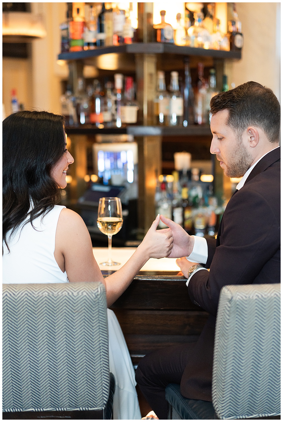 Couple share a handshake for Hotel Icon Engagement Session