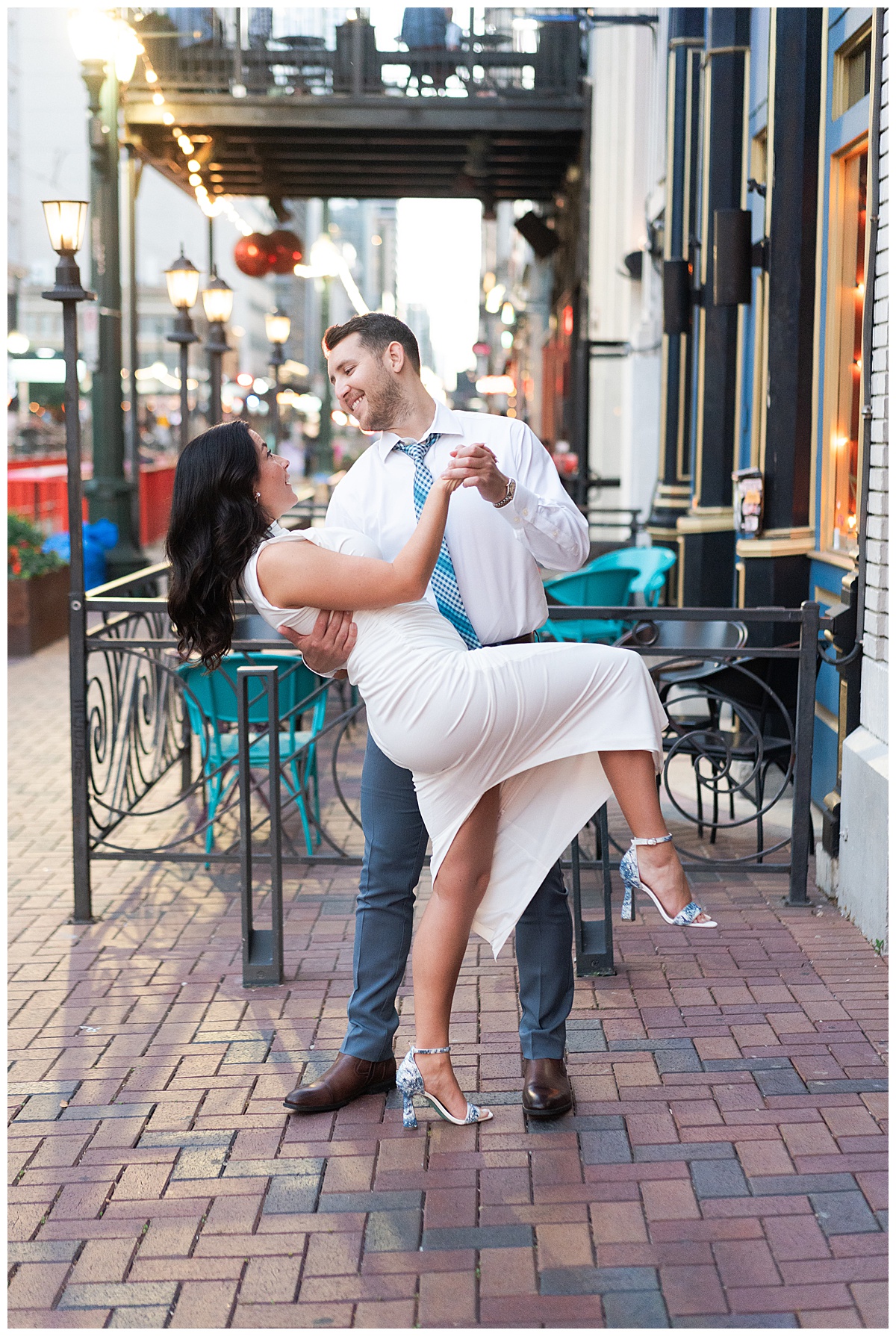 Man and woman dance together for Hotel Icon Engagement Session