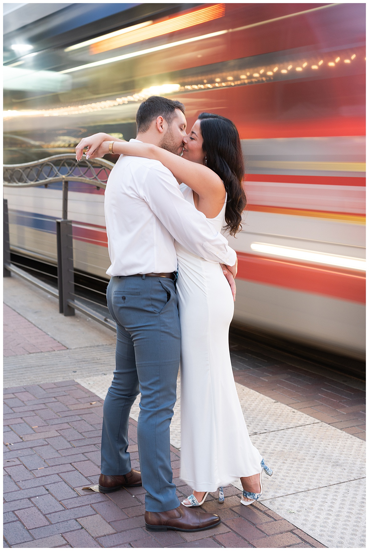 Two people share a kiss during their Hotel Icon Engagement Session