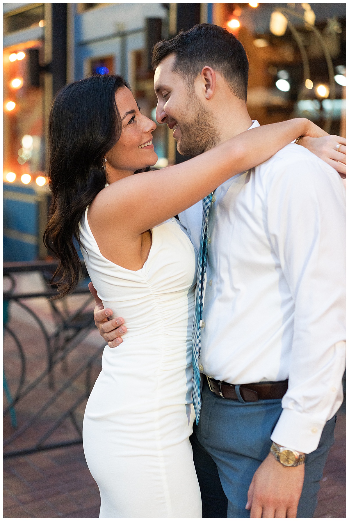 Man and woman smile at one another for Swish & Click Photography