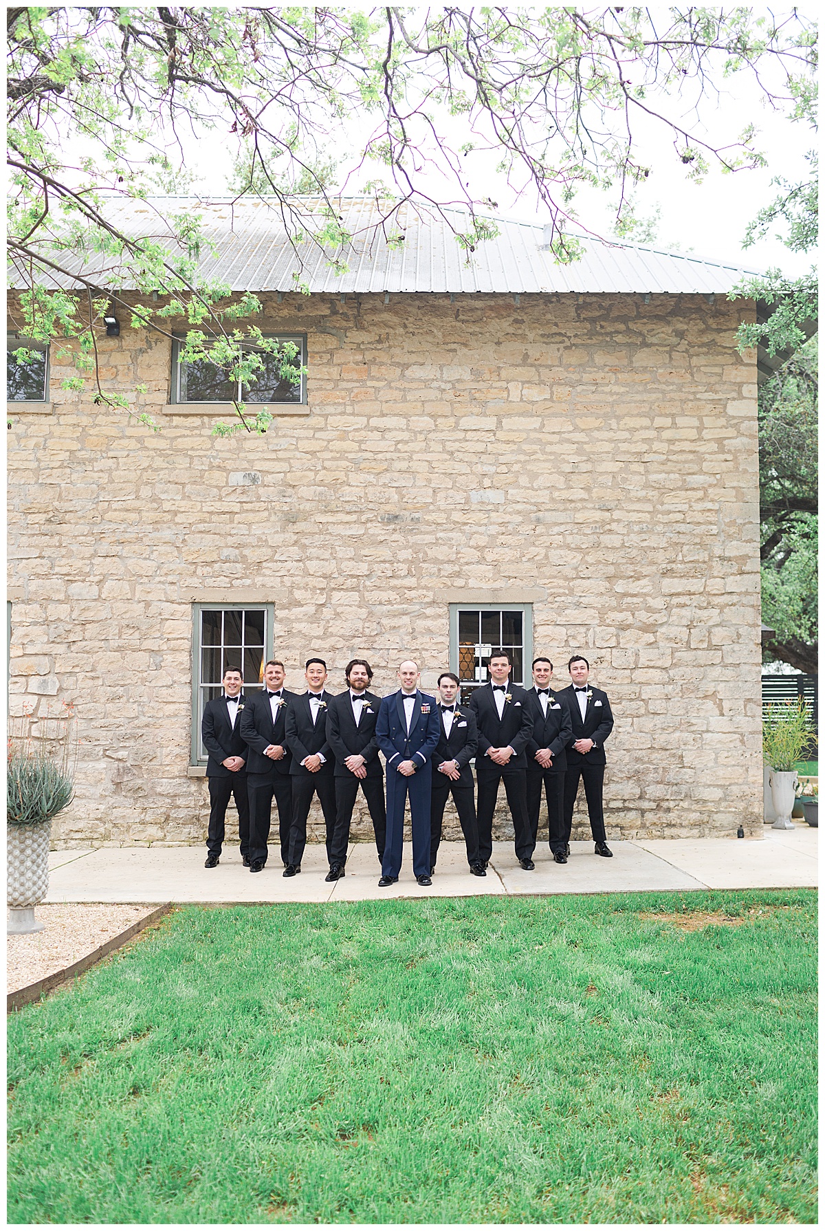 Groomsmen stand together during a Stonehouse Villa Wedding