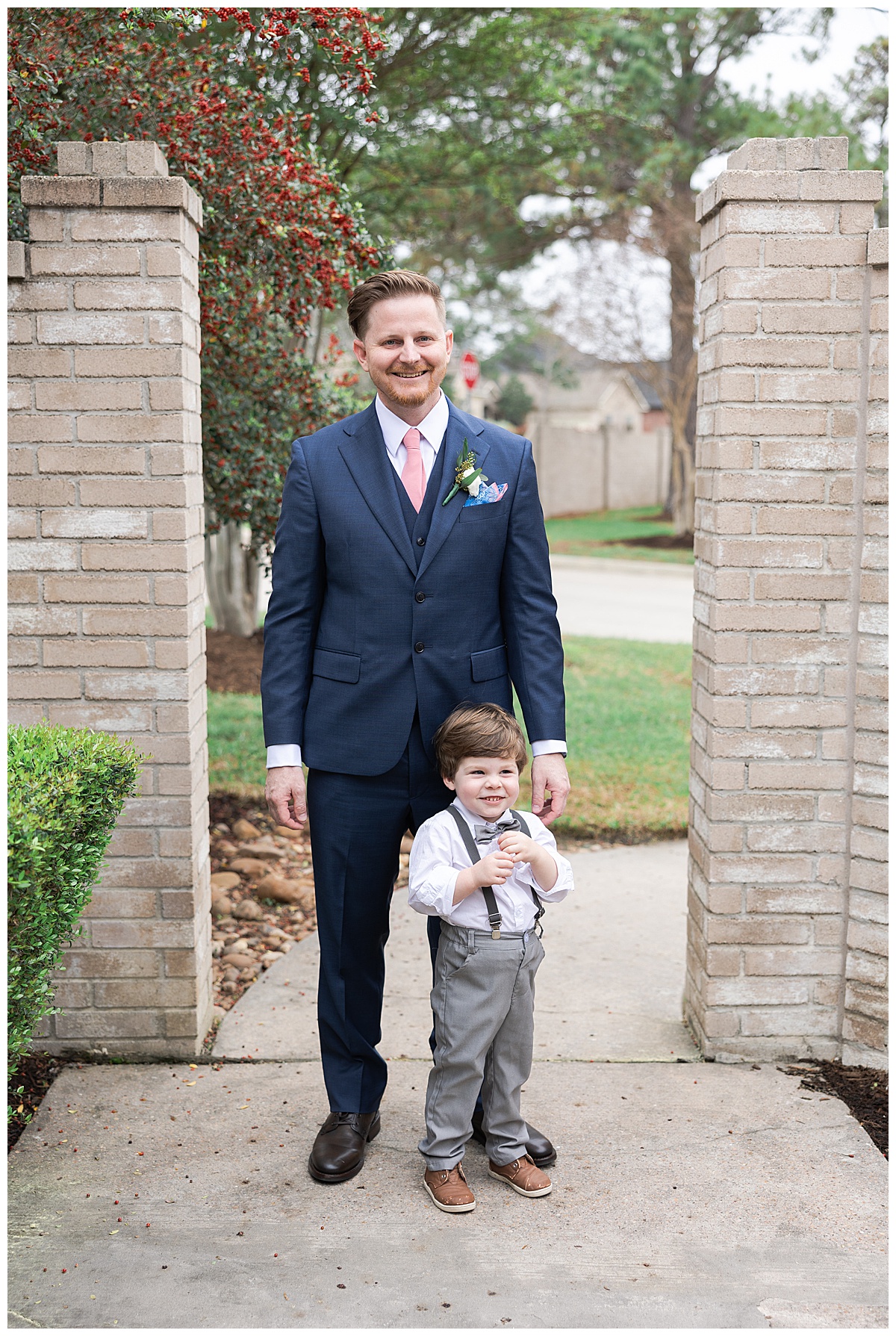 Groom stands with young boy 