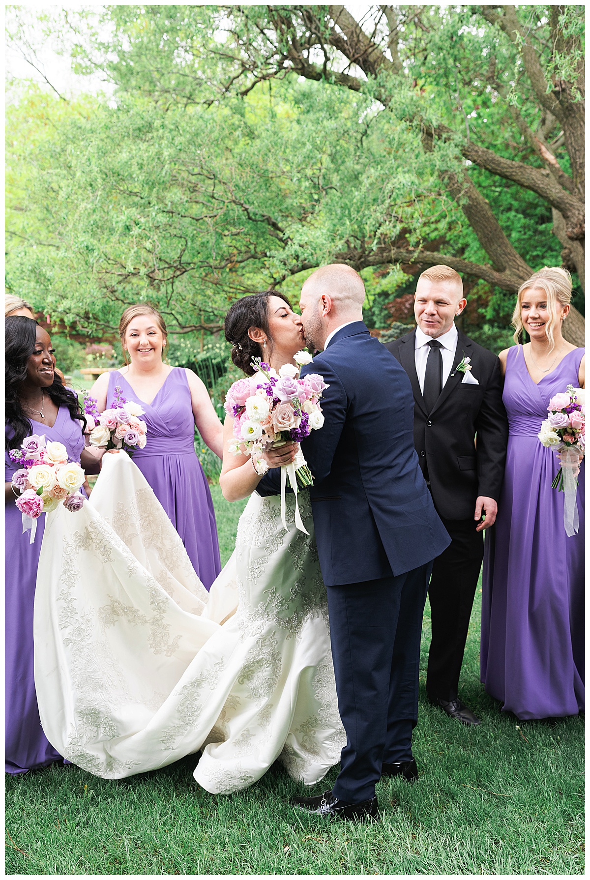 Bride and groom share a kiss for Swish & Click Photography