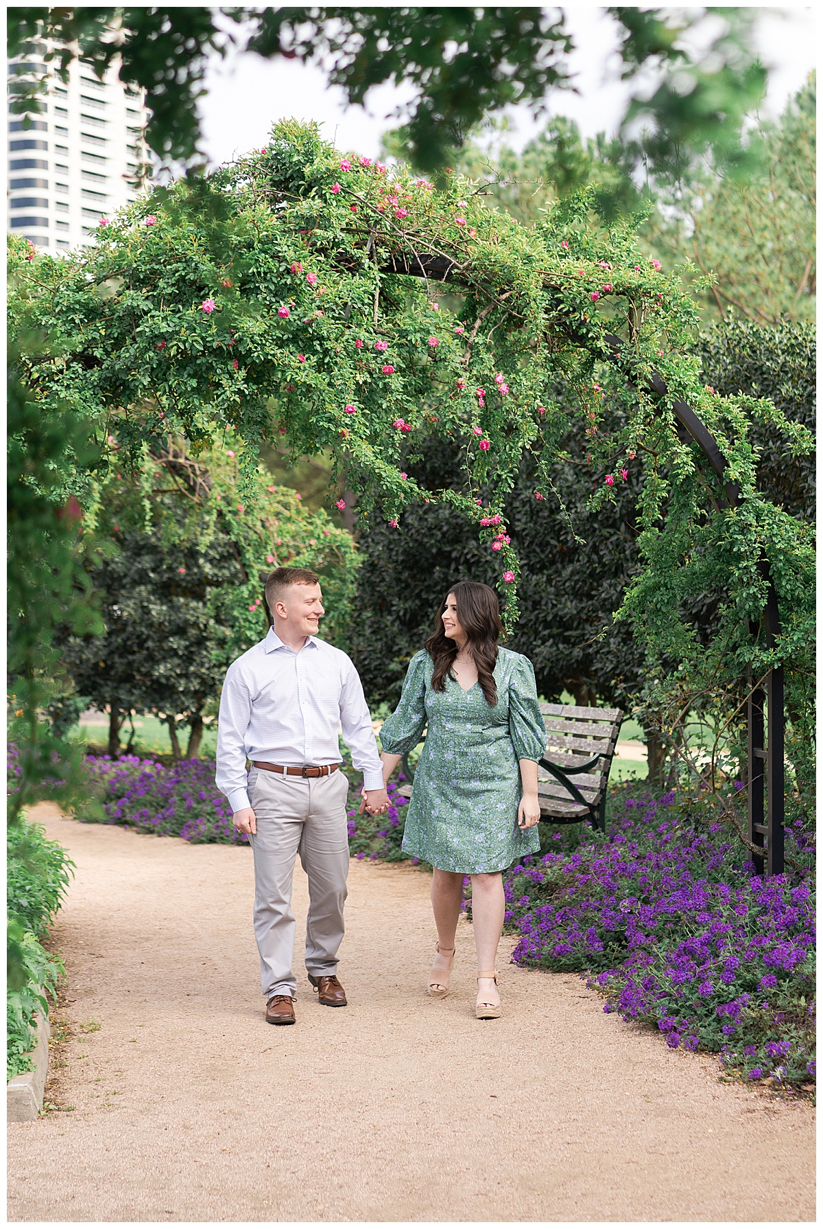 Man and woman walk hand in hand together showing one of the Best Engagement Photo Locations in Houston