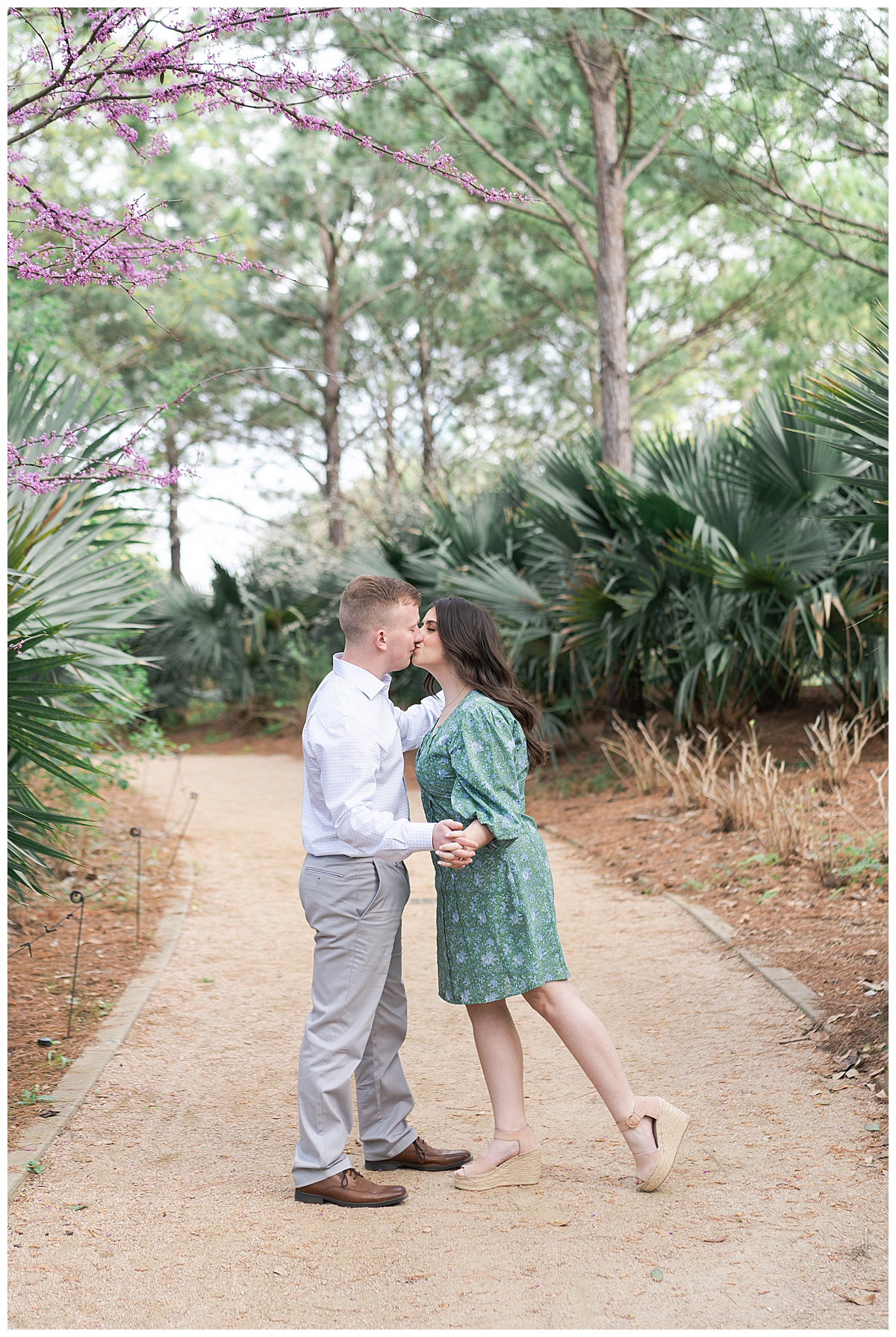 Couple share a kiss showing one of the Best Engagement Photo Locations in Houston