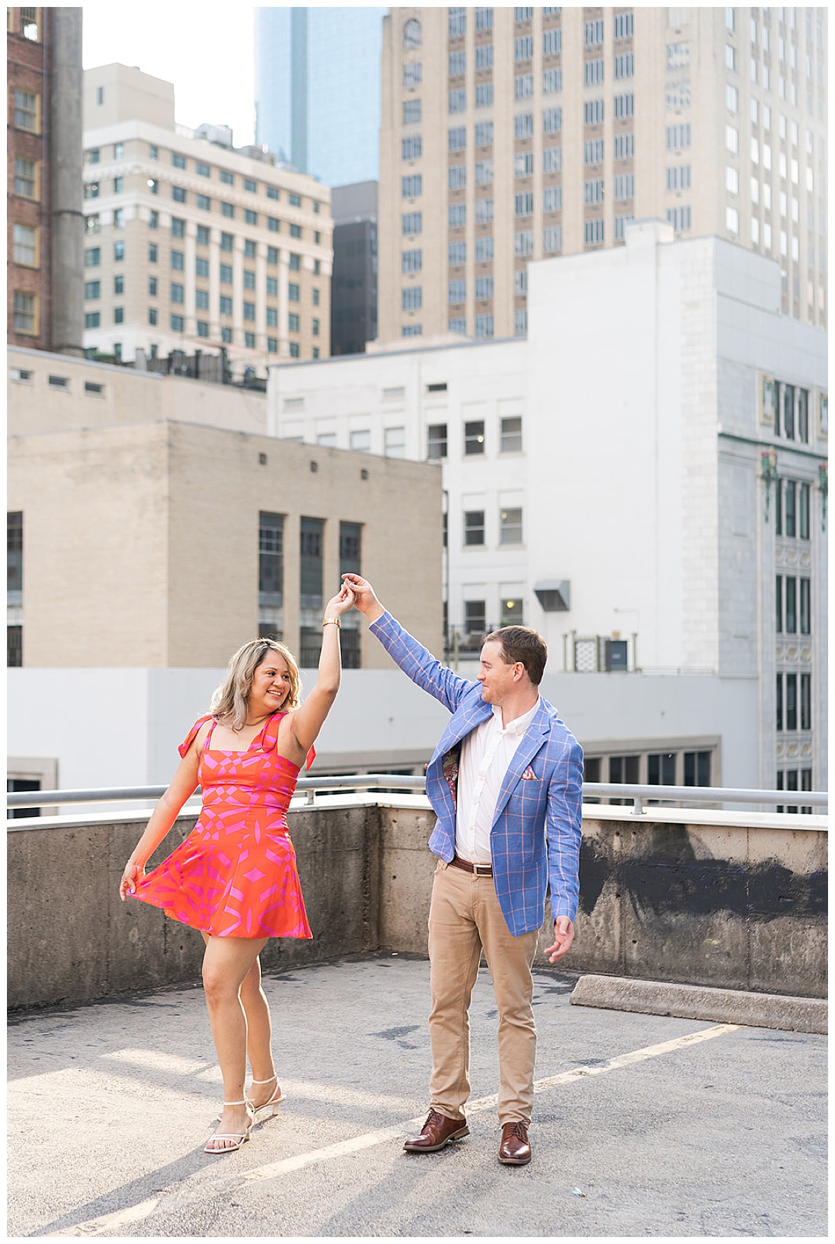 Man and woman dance together showing one of the Best Engagement Photo Locations in Houston