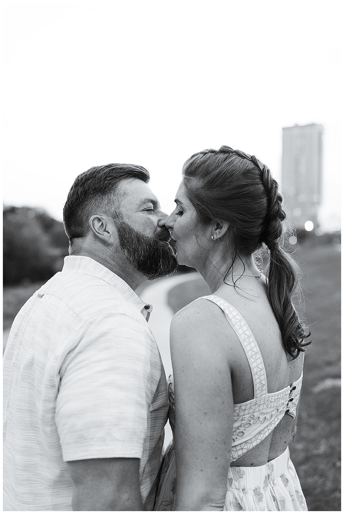 Couple share a kiss together showing one of the Best Engagement Photo Locations in Houston