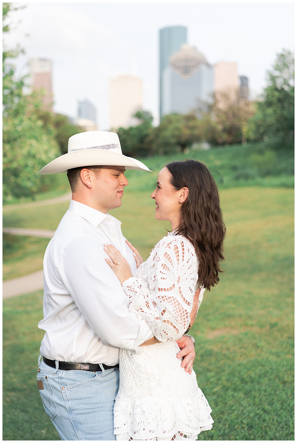 Man and woman smile at one another showing one of the Best Engagement Photo Locations in Houston