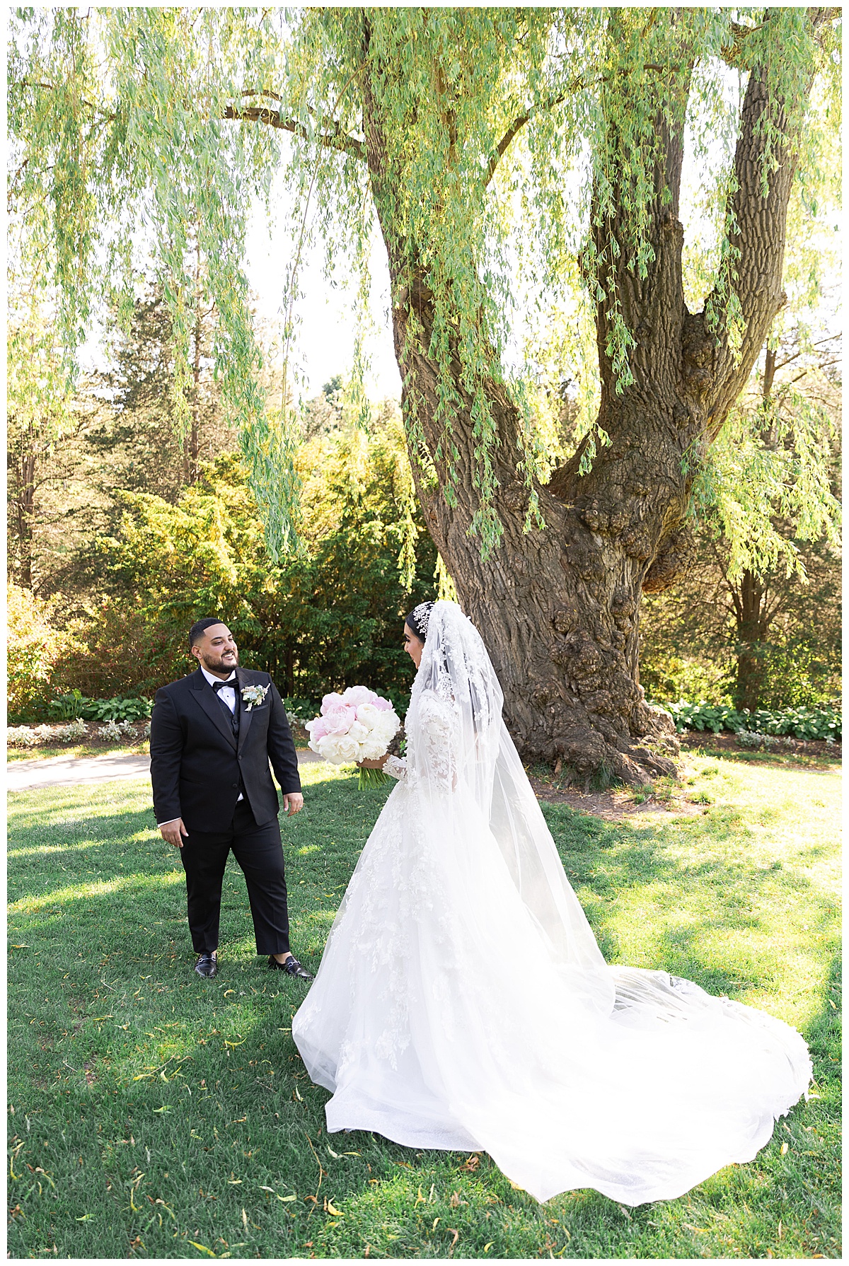 Bride and groom admire each other by Swish & Click Photography