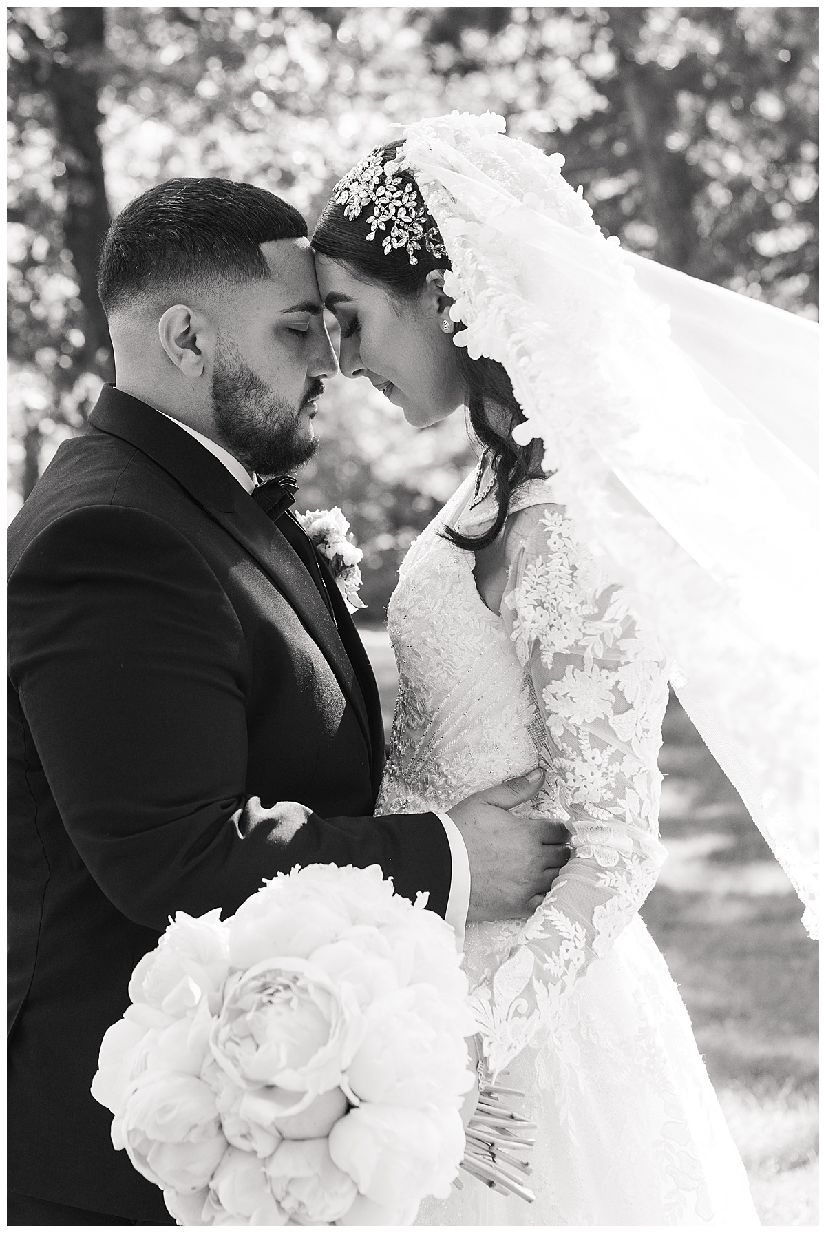 Groom holds bride in close by Swish & Click Photography