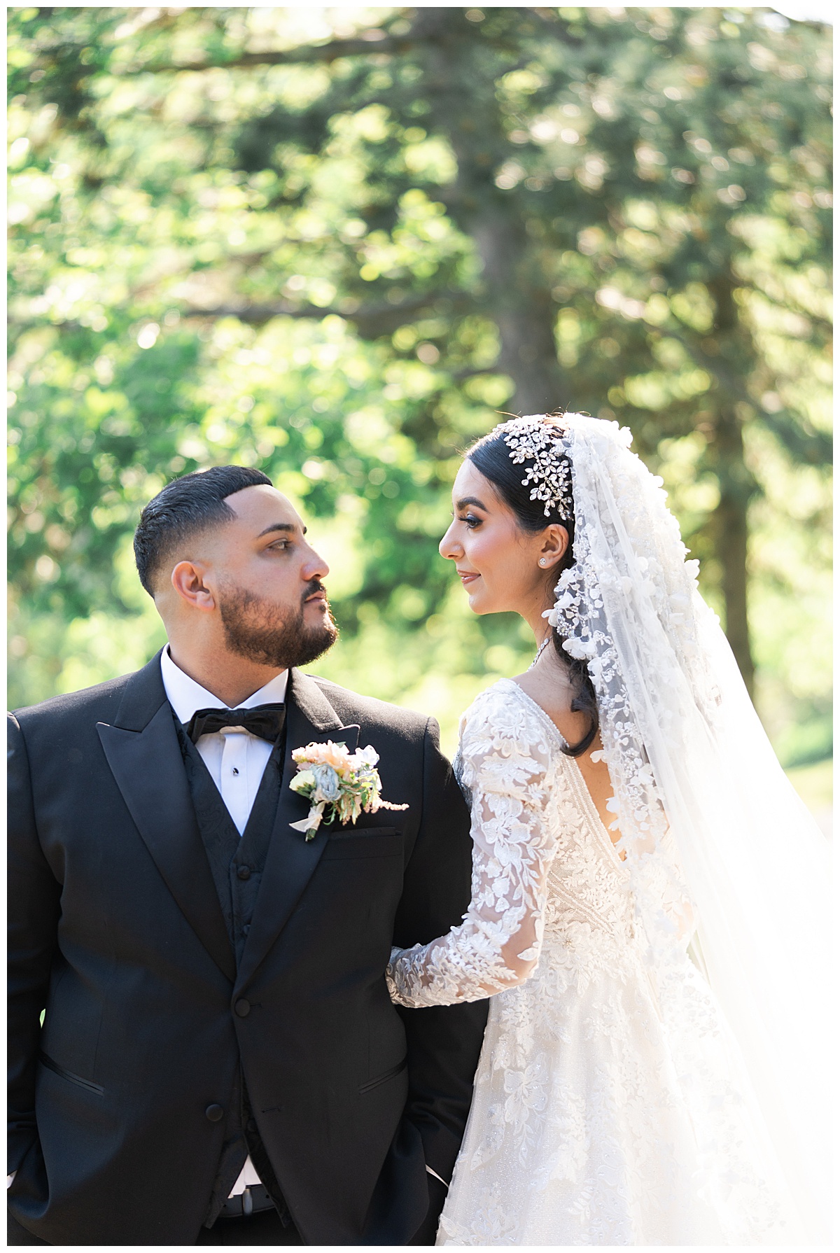 Couple look at one another by Swish & Click Photography