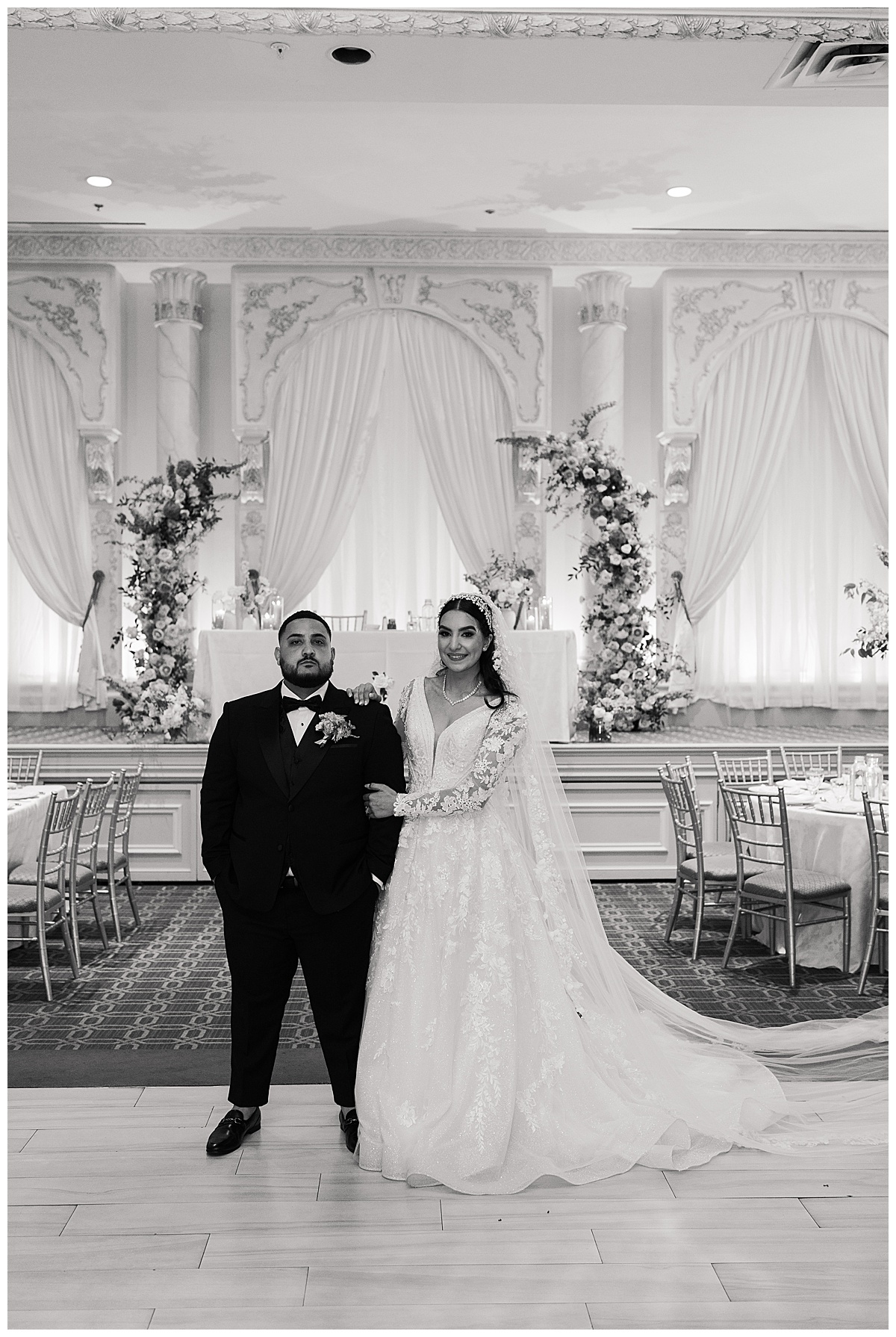 Bride and groom stand together by Swish & Click Photography