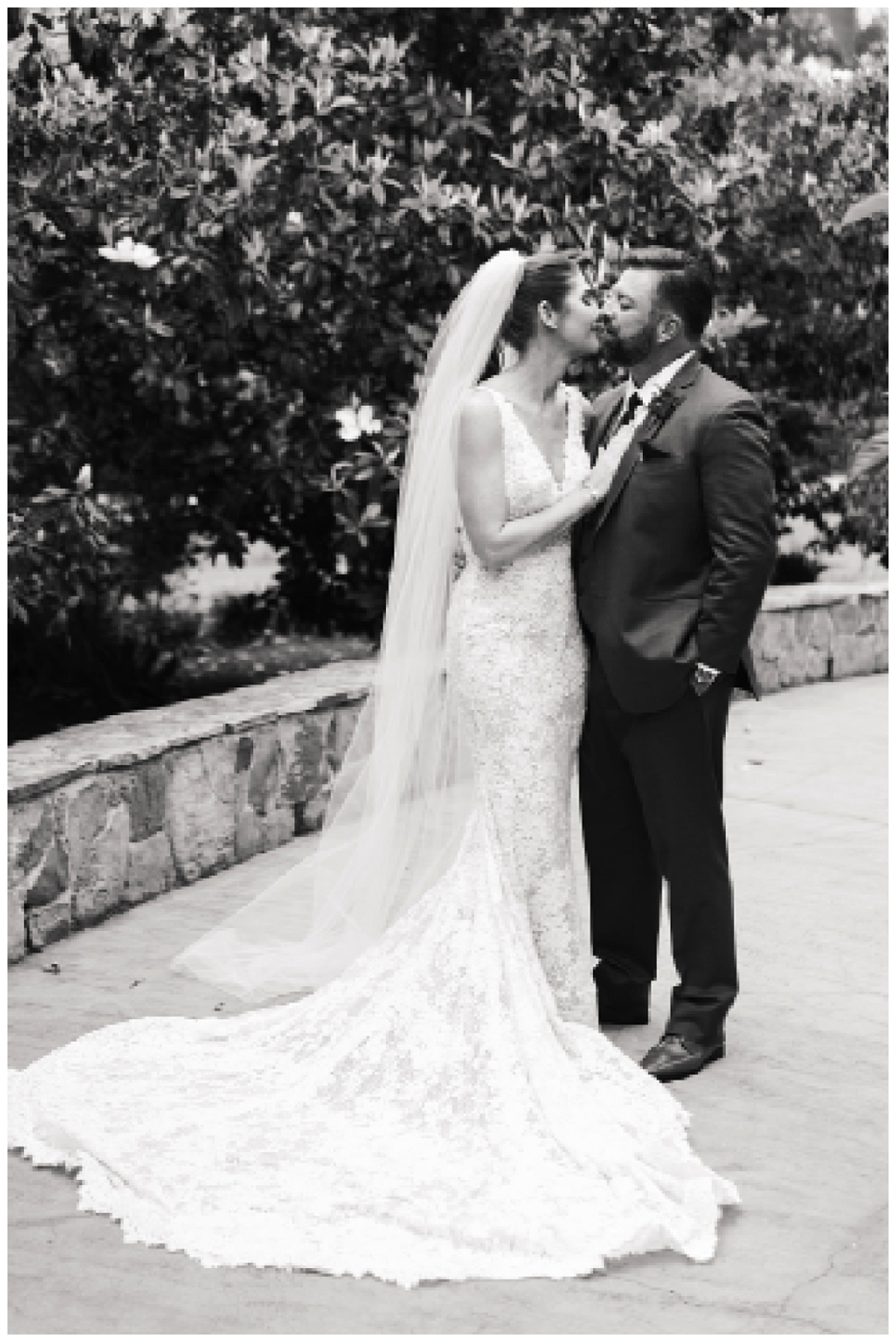 Husband and wife share a kiss for Swish & Click Photography