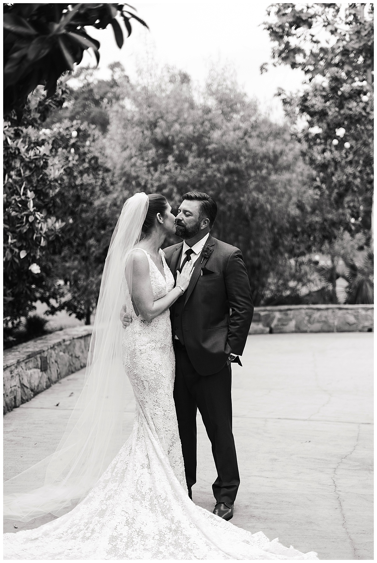 Couple share a kiss by Houston’s Best Wedding Photographers 