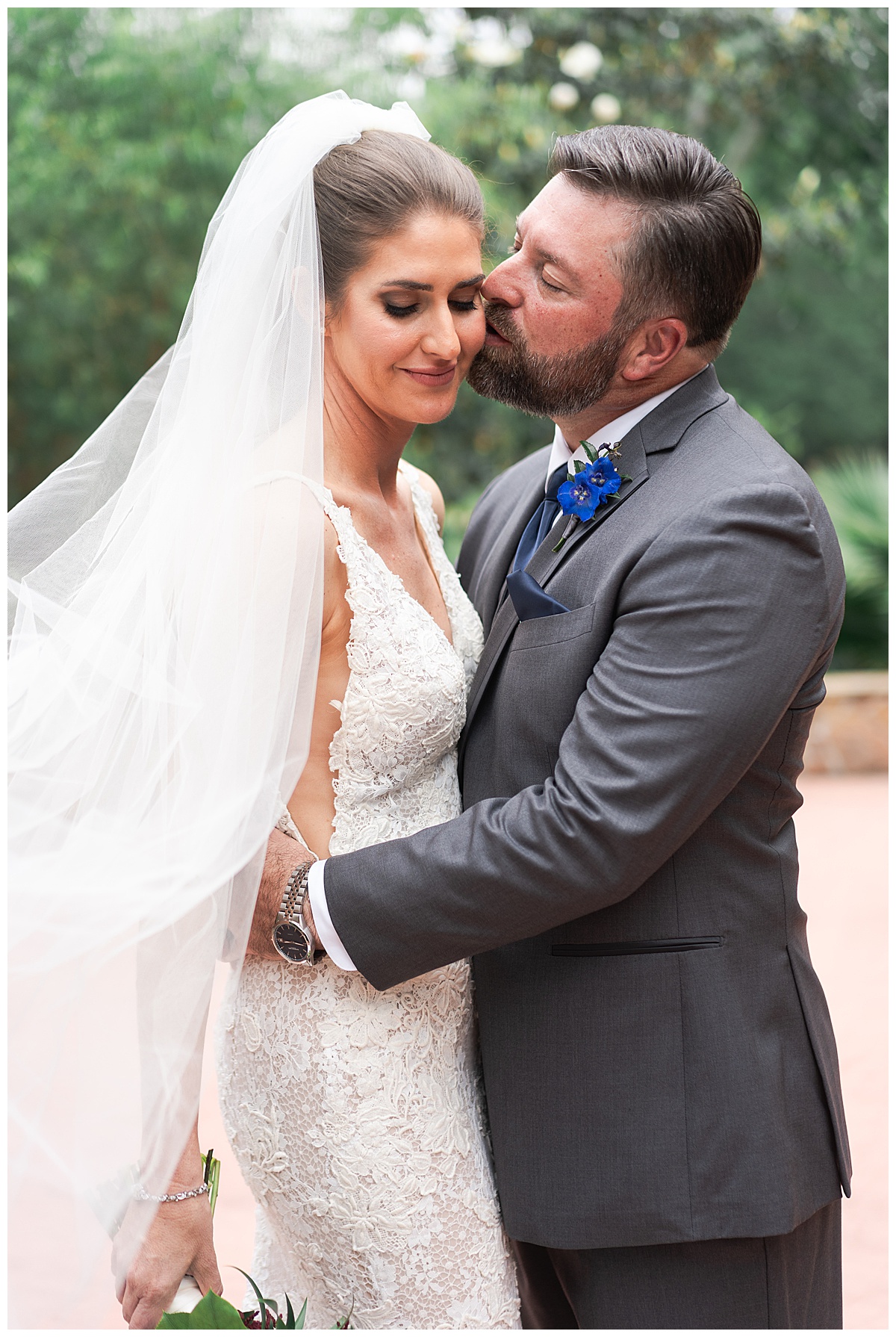 Man kisses woman on the cheek by Houston’s Best Wedding Photographers 