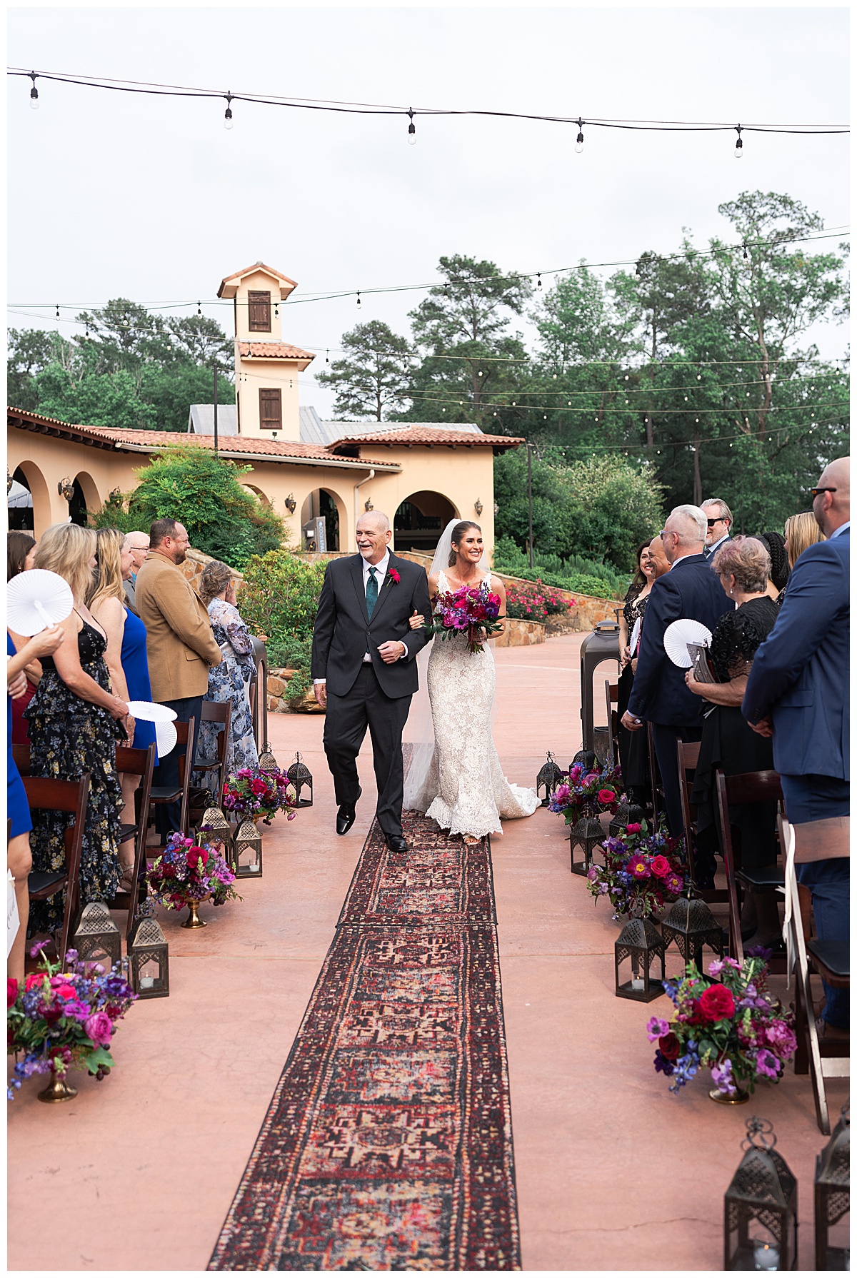 Bride walks down the aisle with her father by Swish & Click Photography