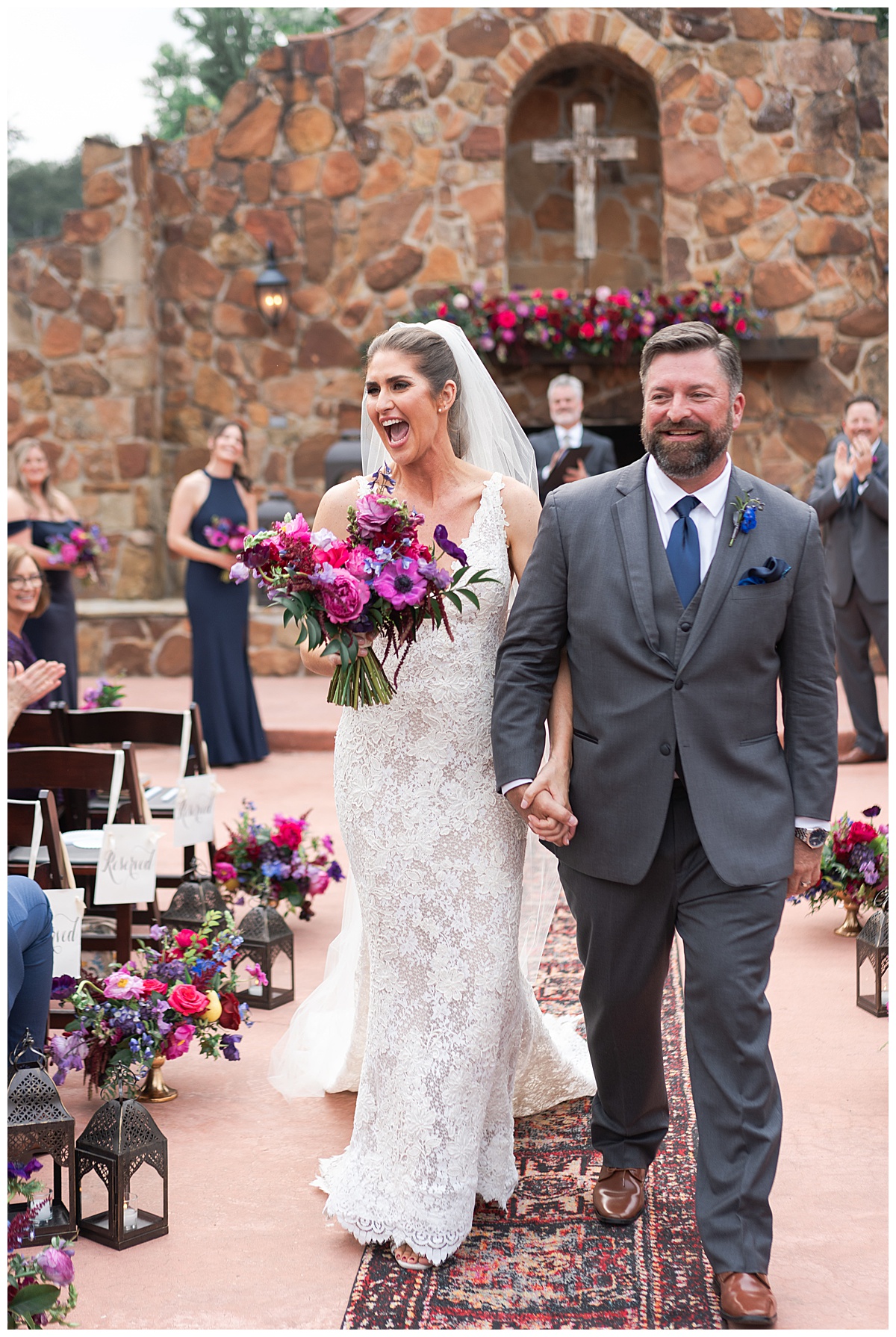 Couple walk hand in hand together by Swish & Click Photography