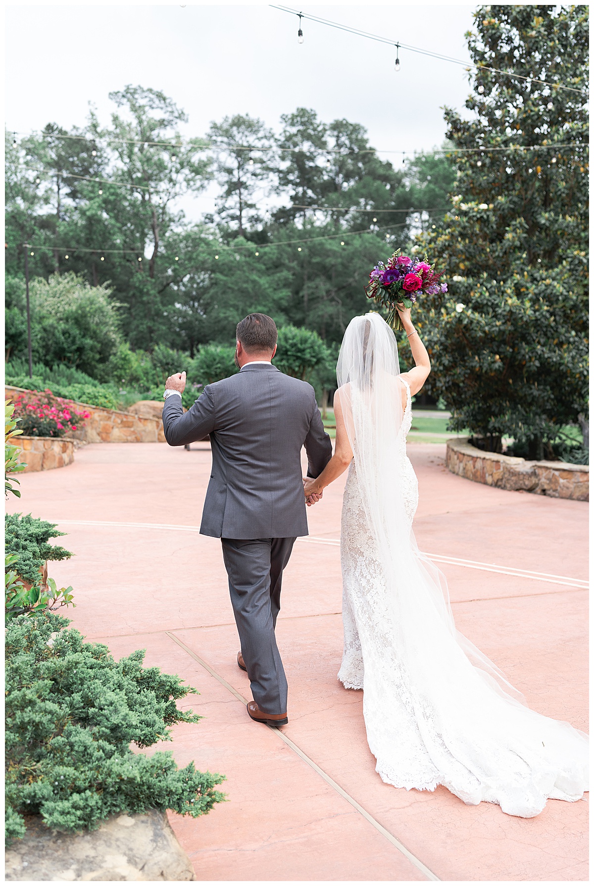 Happy couple walk together by Madera Estates Wedding Photographer