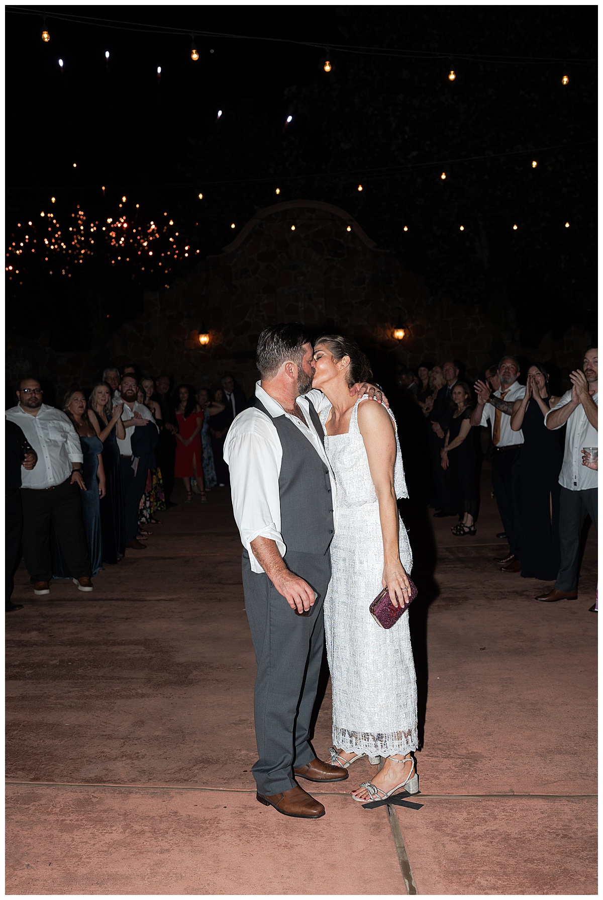 Bride and groom share a kiss for Swish & Click Photography