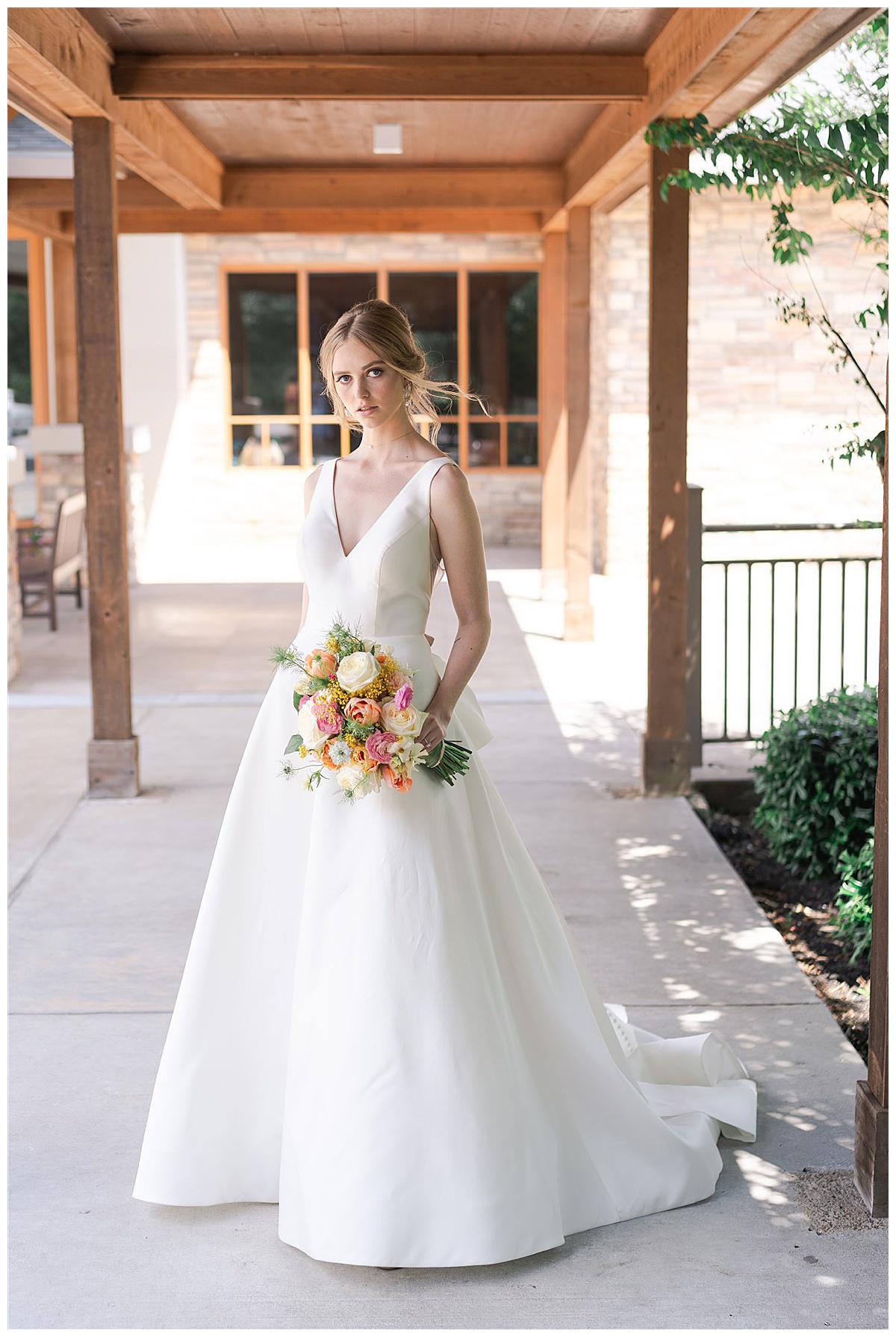 Bride holds bouquet at The Woodlands Country Club