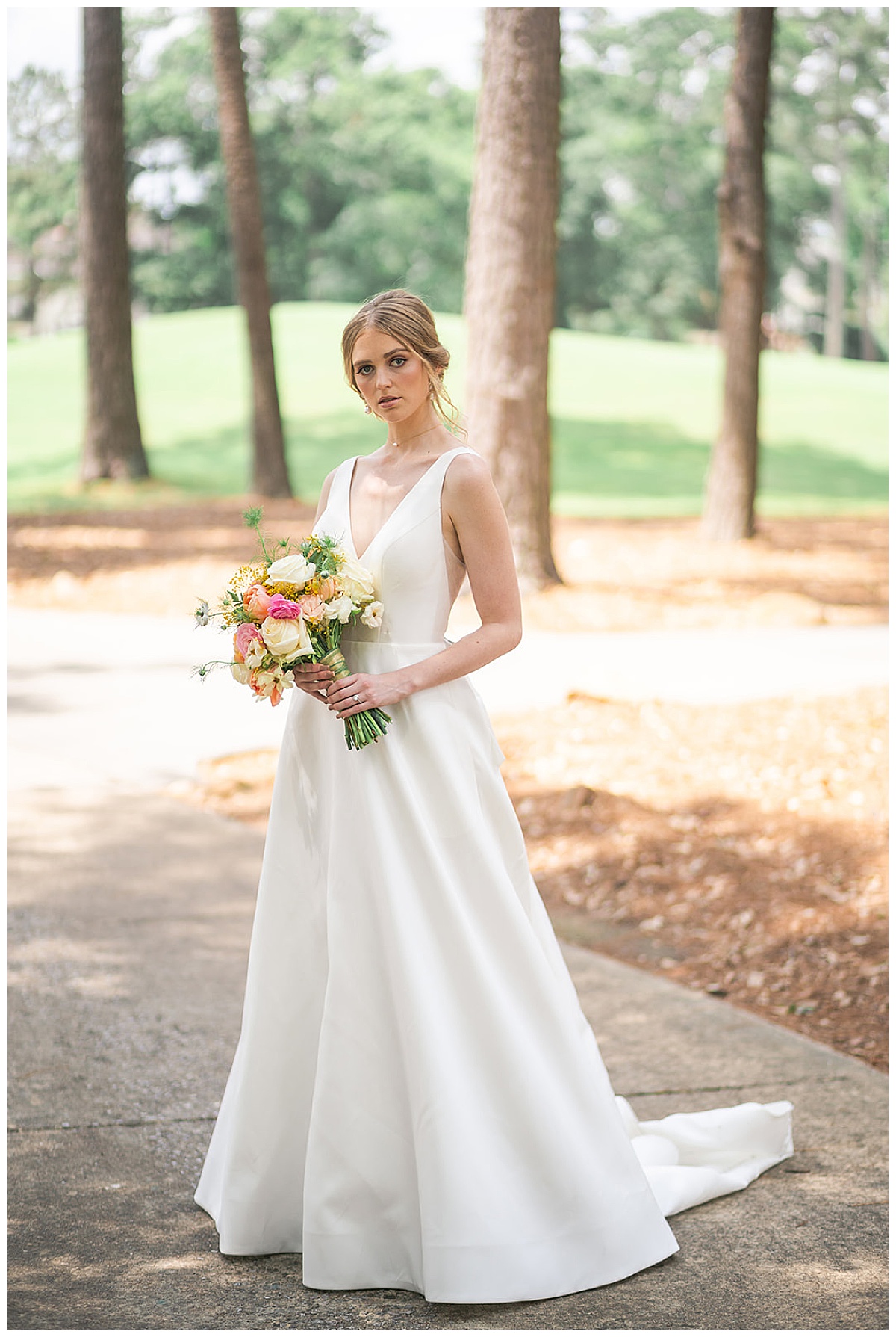 Bride holds wedding bouquet outside for Swish & Click Photography