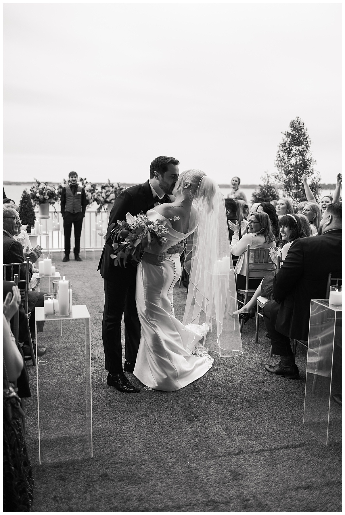 Bride and groom share a kiss by Modern Houston Wedding Photographer