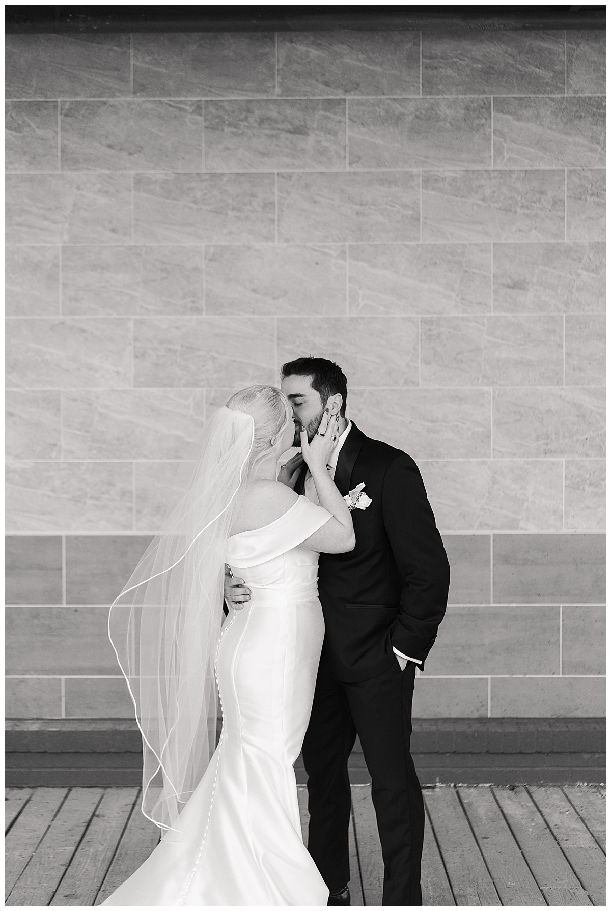 Bride and groom share a kiss by Modern Houston Wedding Photographer