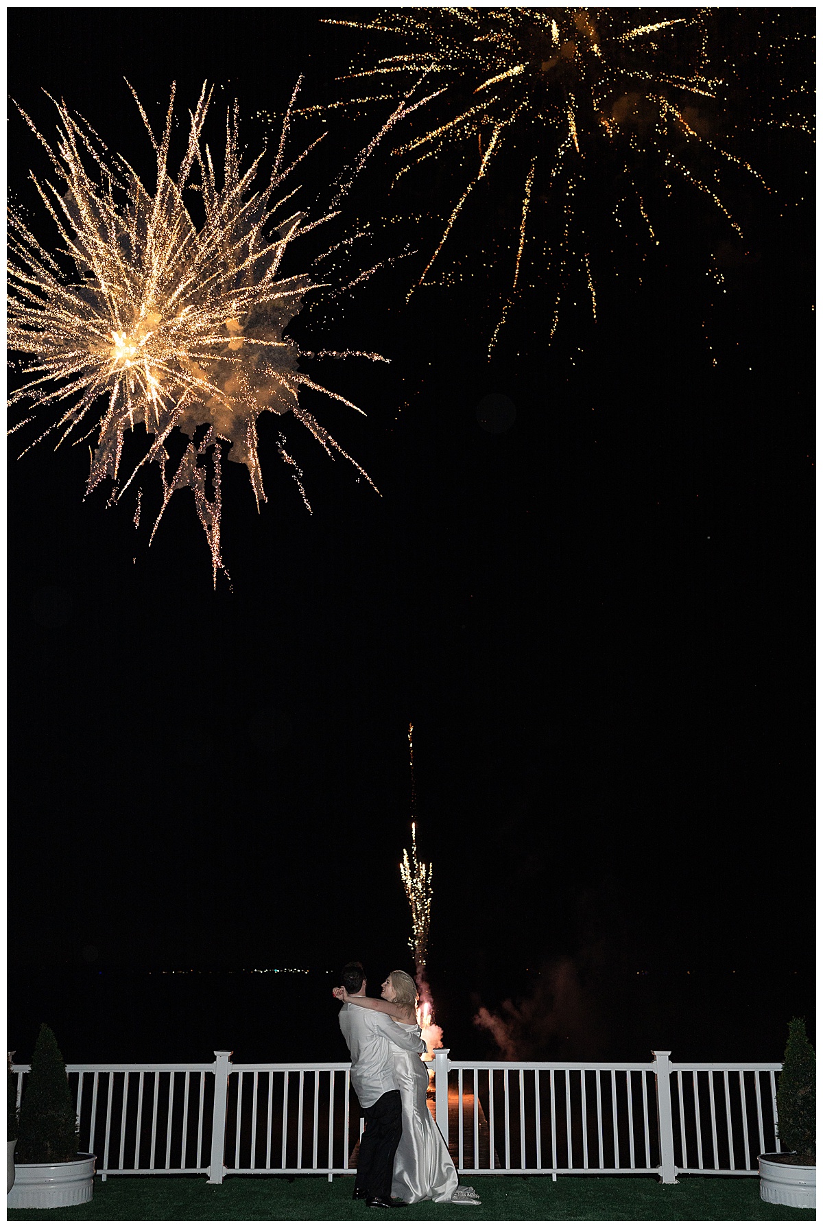 Bride and groom enjoy fireworks by Modern Houston Wedding Photographer