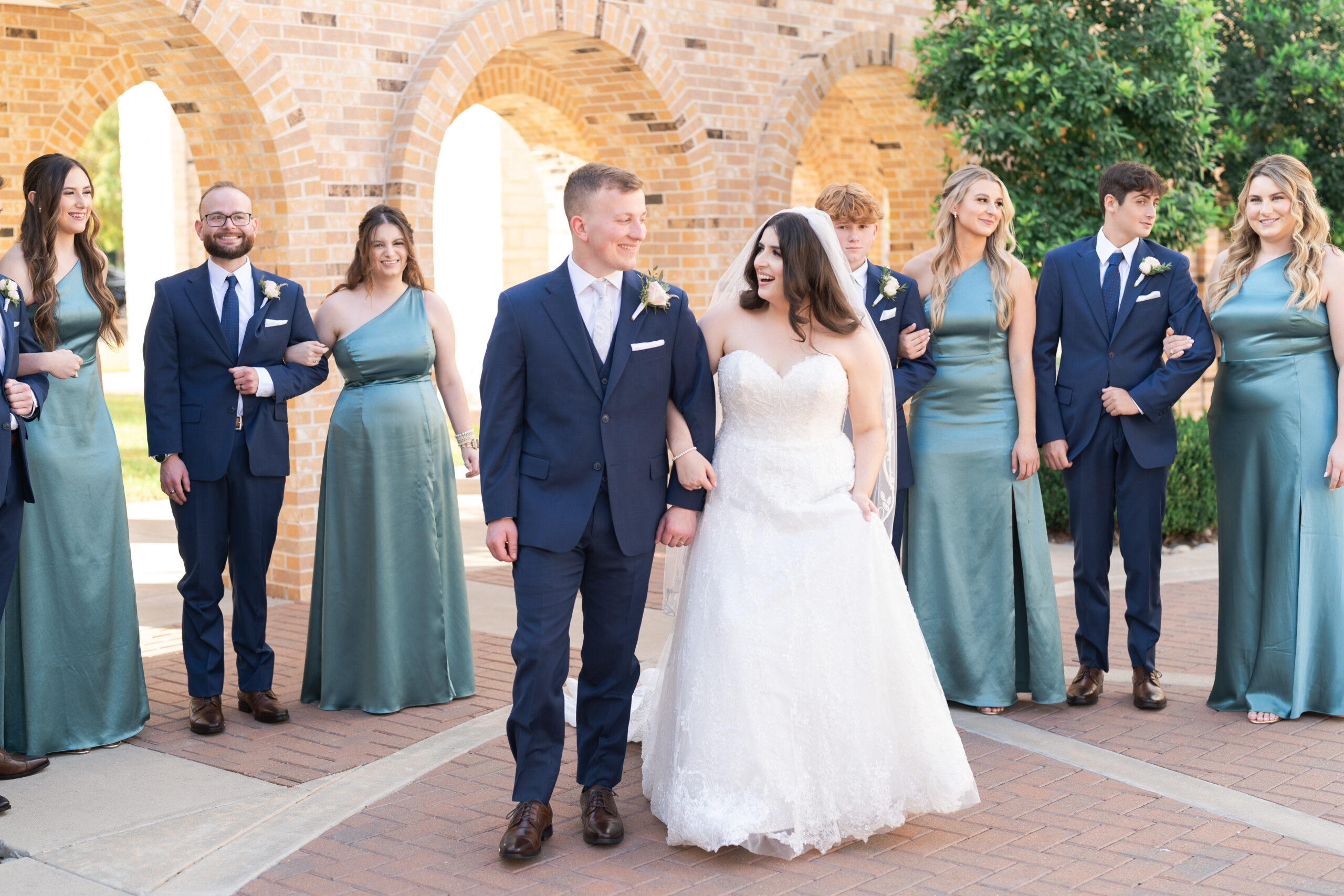 Bride and Groom with wedding party celebrating after ceremony