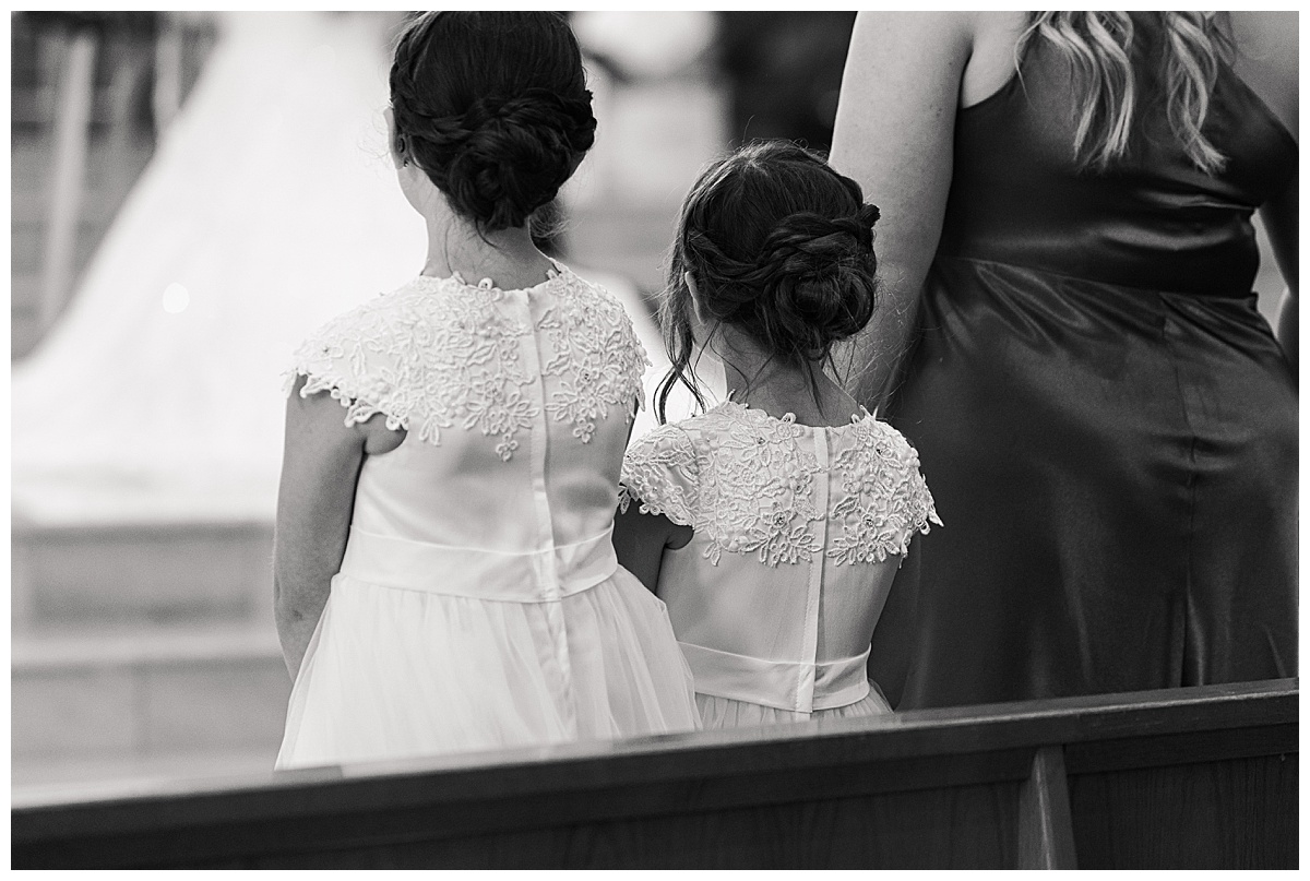 Sweet moment of flower girls photographed by Swish & Click Photography